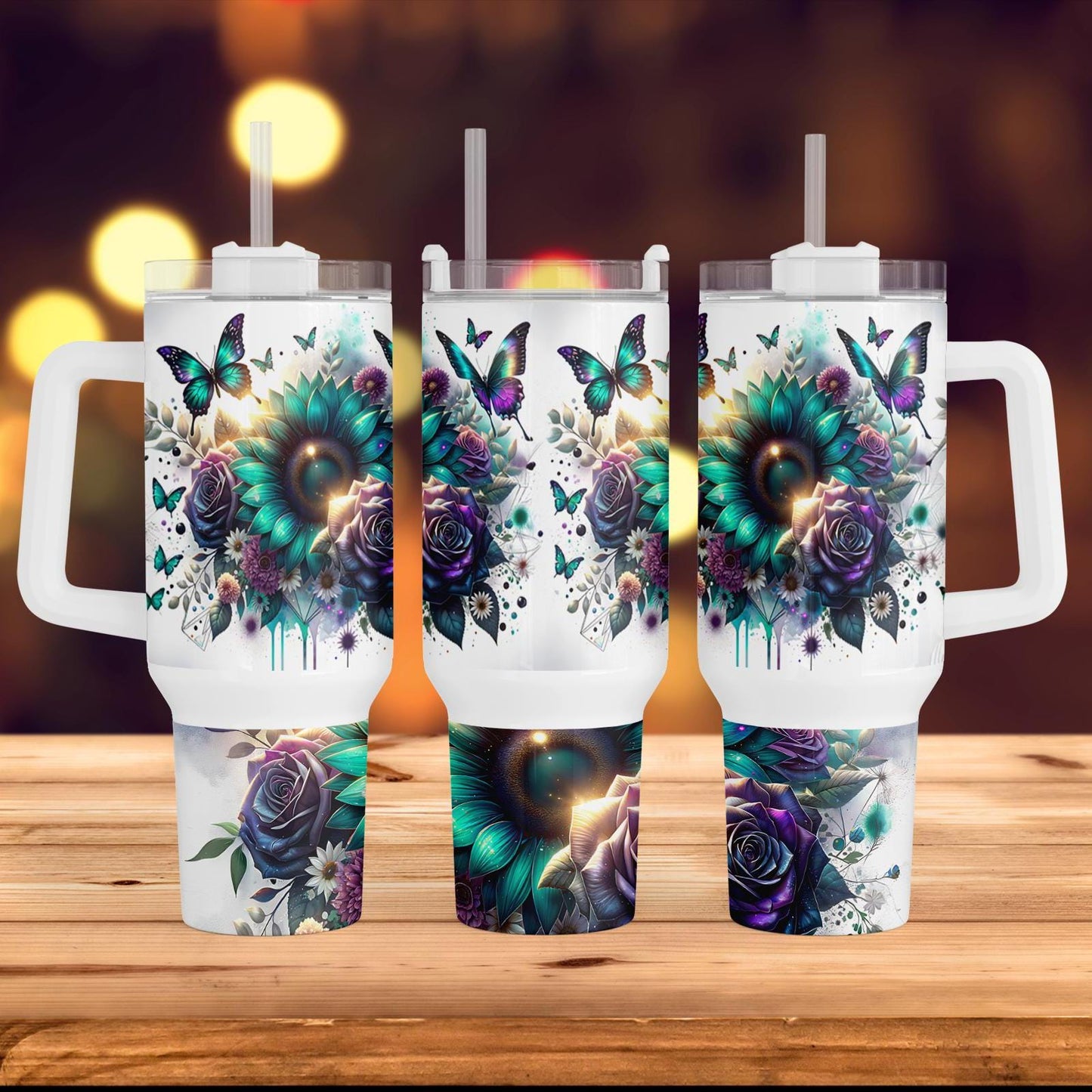three travel mugs with floral designs on them