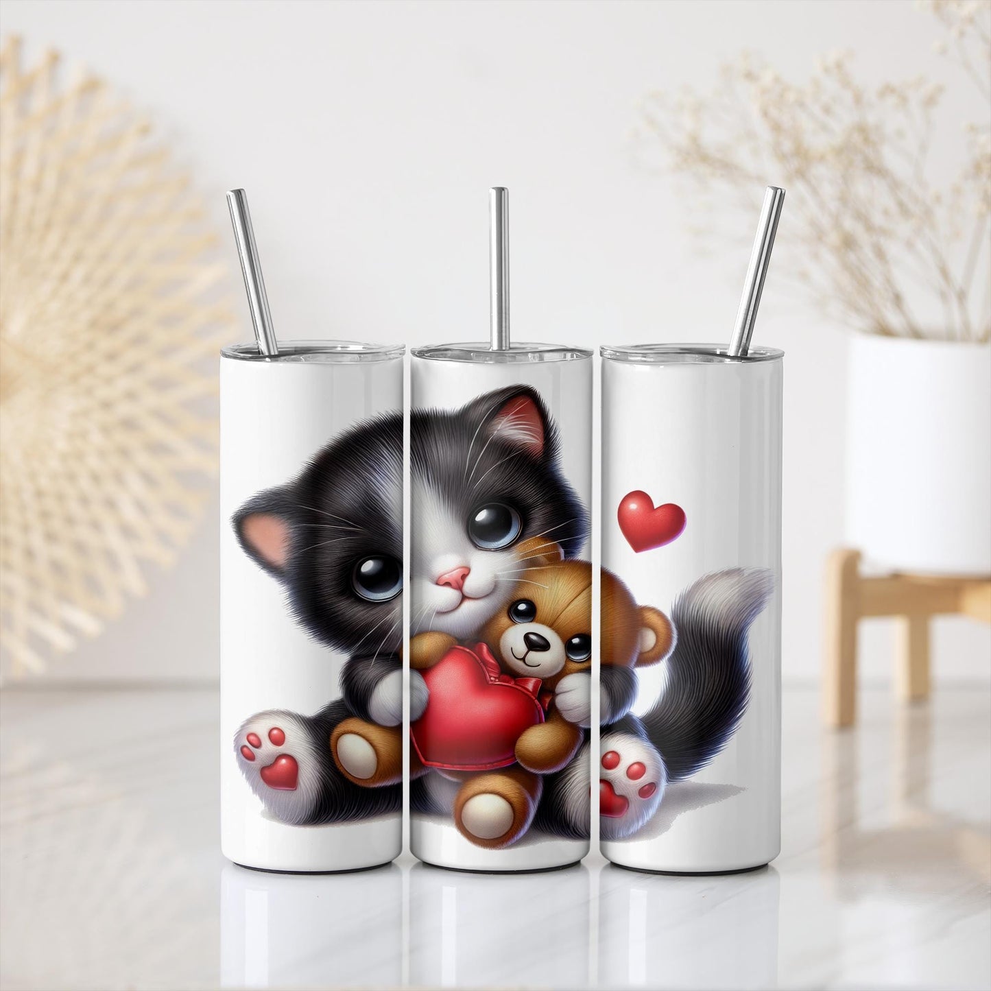 a couple of toothbrushes with a picture of a cat holding a teddy bear