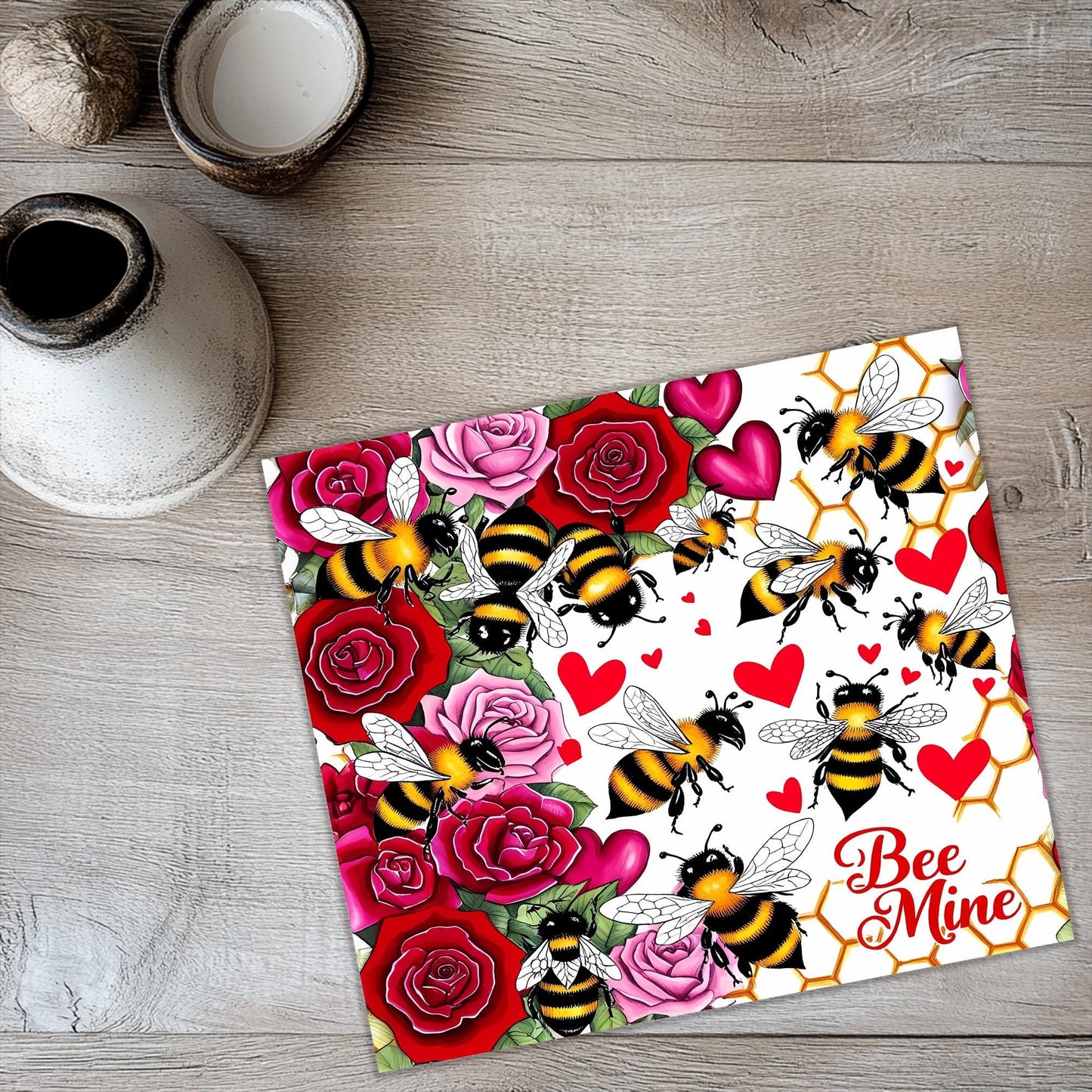 a card with a bee and roses pattern on it
