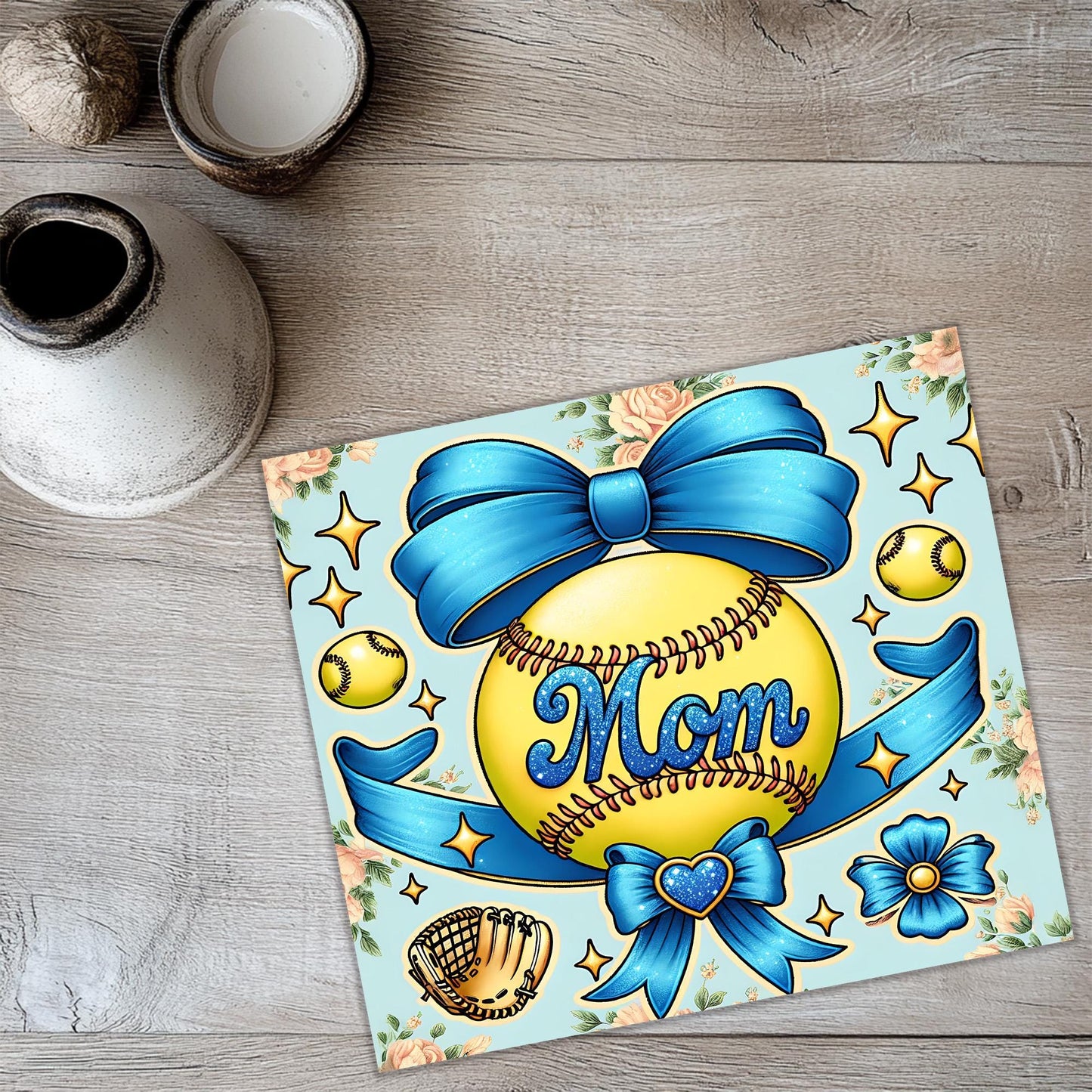 a picture of a softball with a blue bow on it