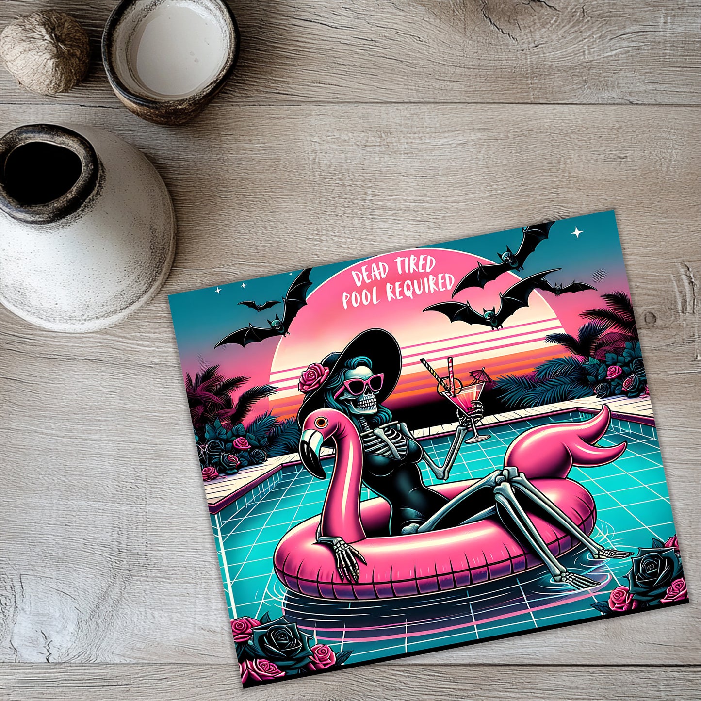 a skeleton wearing a black dress and sunglasses, sitting on a pink flamingo-shaped float in a pool, with a sunset and bats in the background.