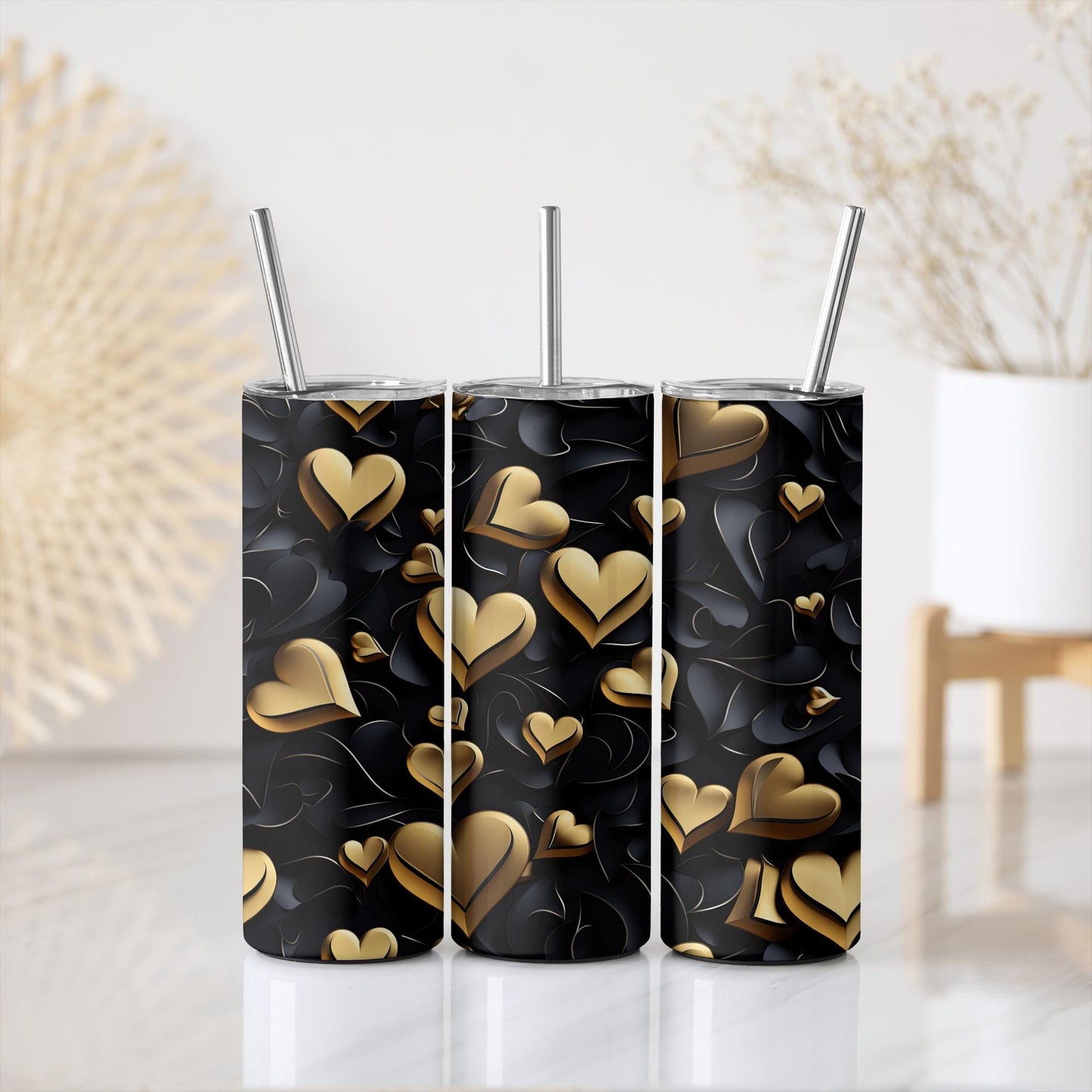 a couple of cups with straws in them on a table