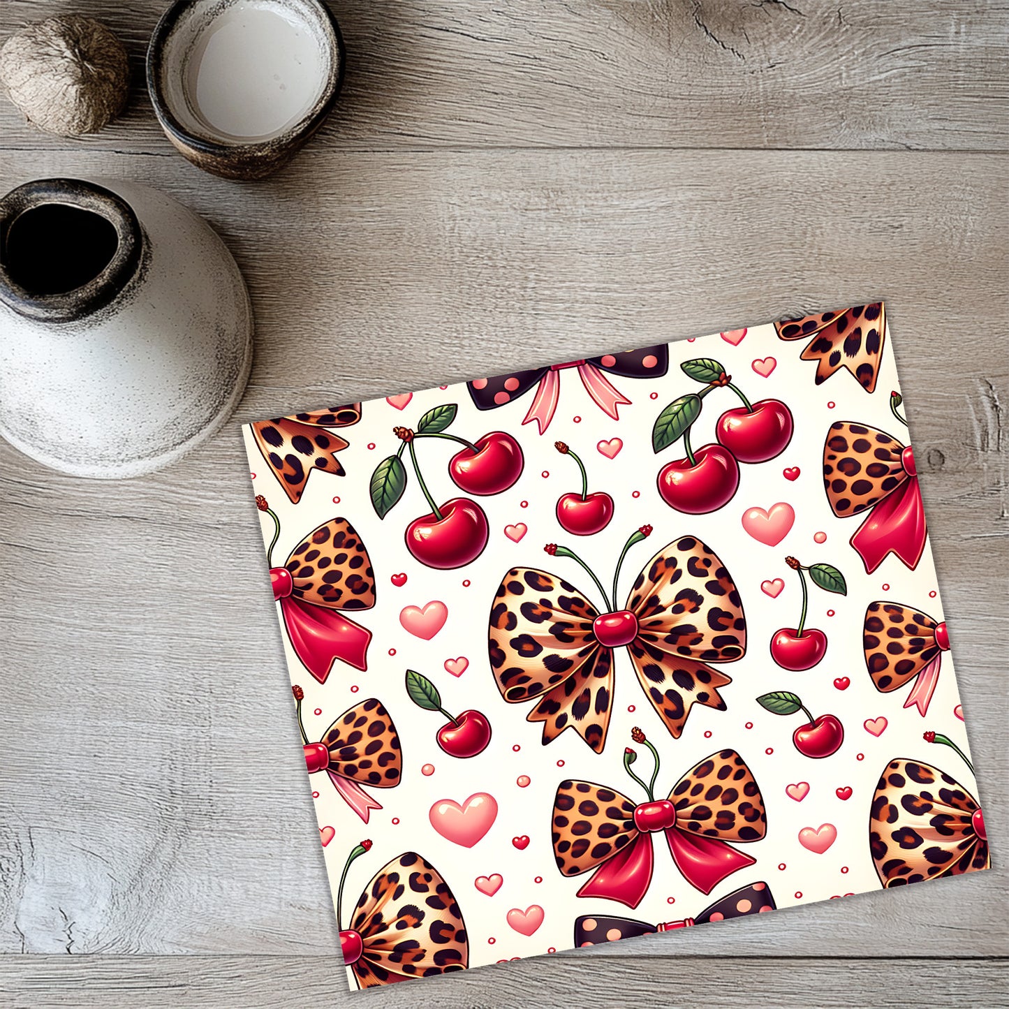 a picture of a place mat with hearts and cherries on it