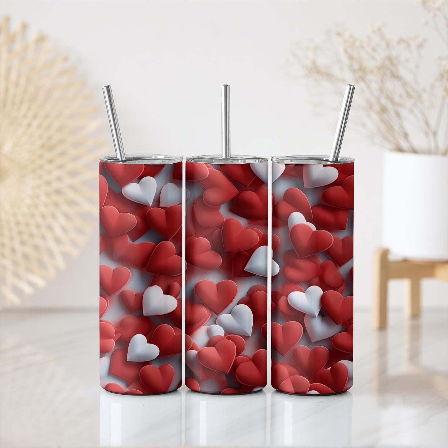 a couple of red and white hearts on a white table