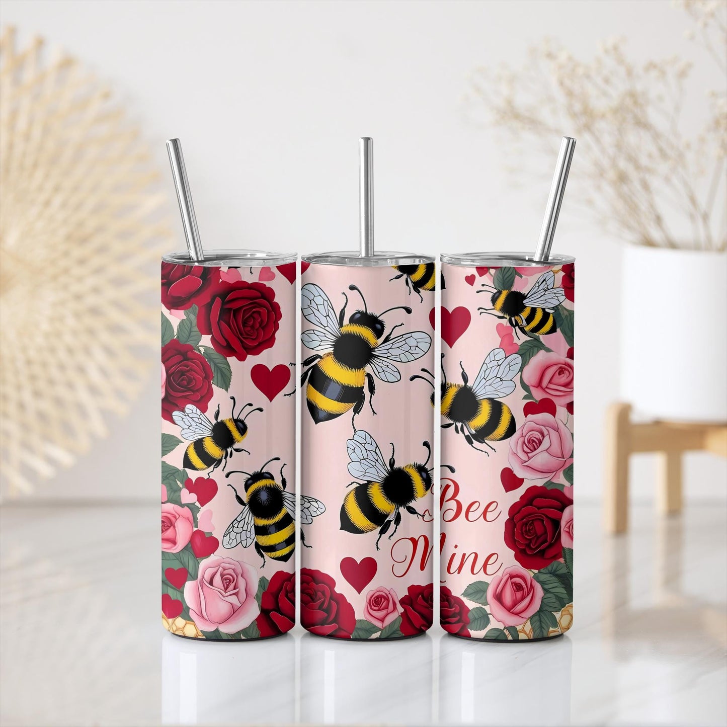 three tumbles with bees and roses on them