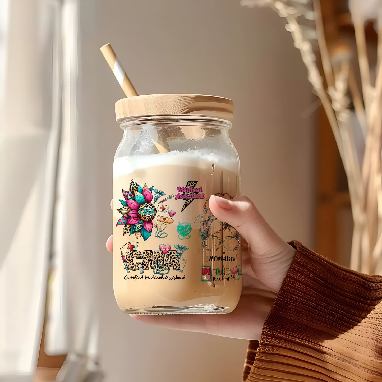 a person holding a jar with a straw in it