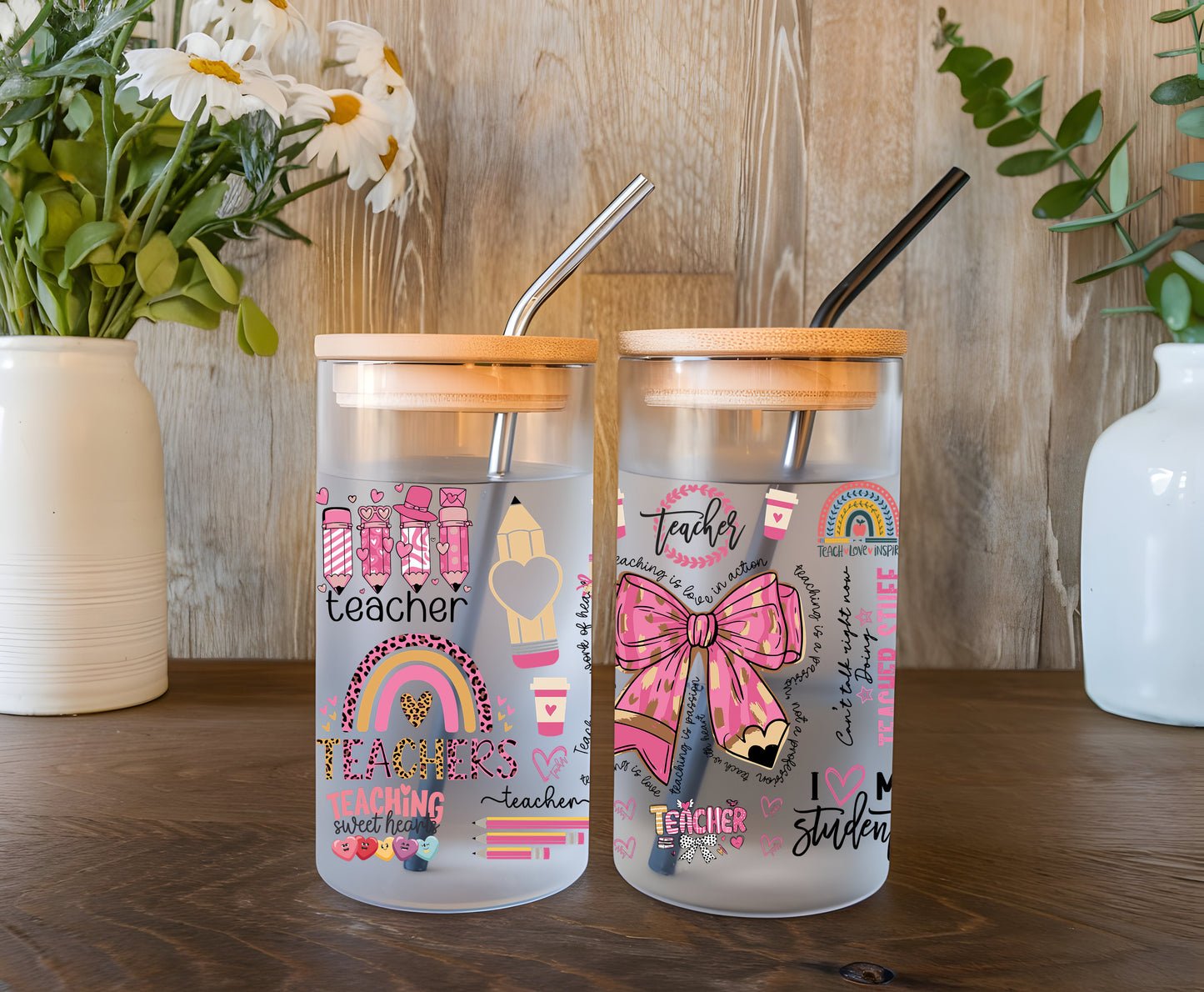 a couple of glass jars sitting on top of a wooden table