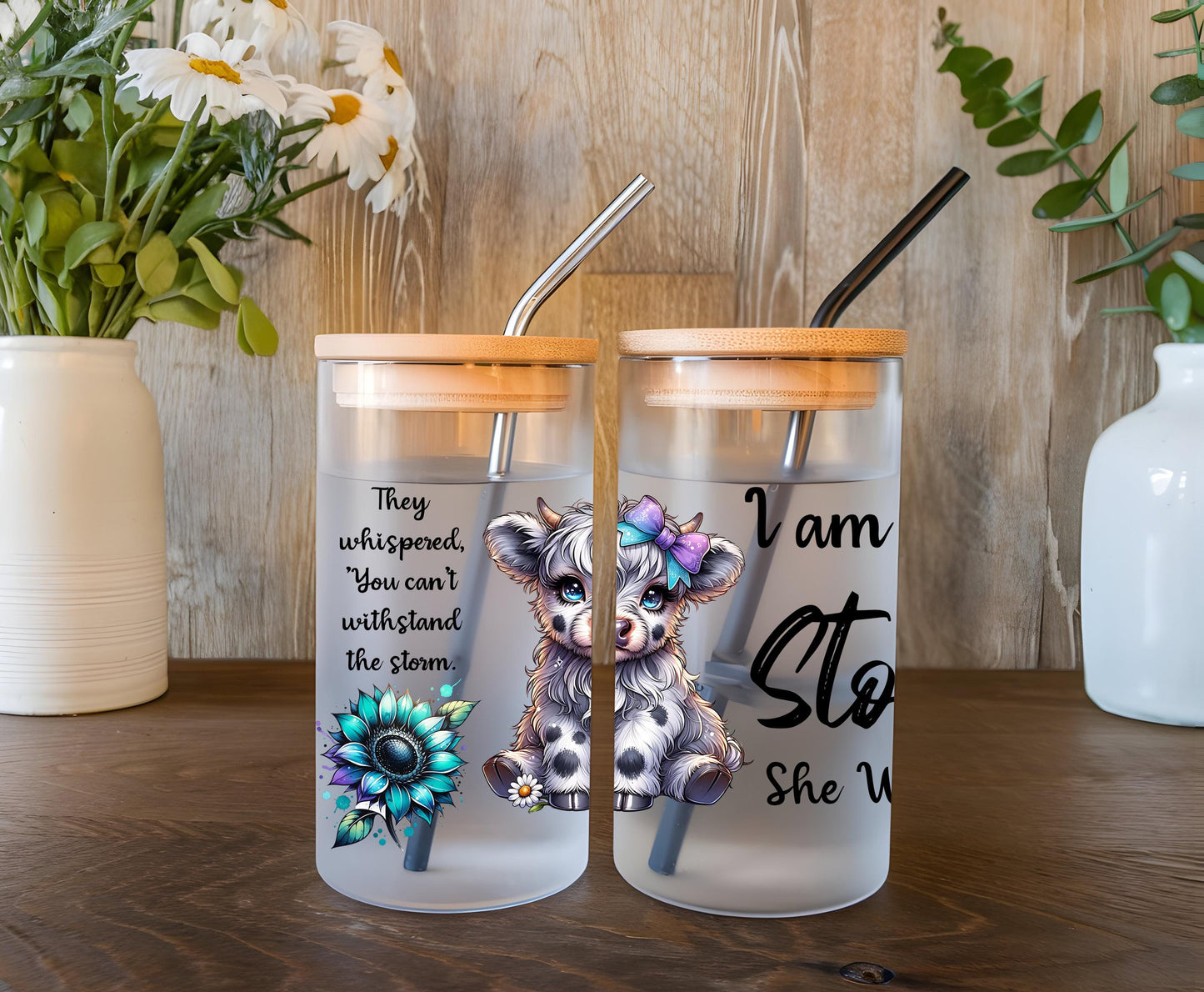 a couple of glass cups sitting on top of a wooden table