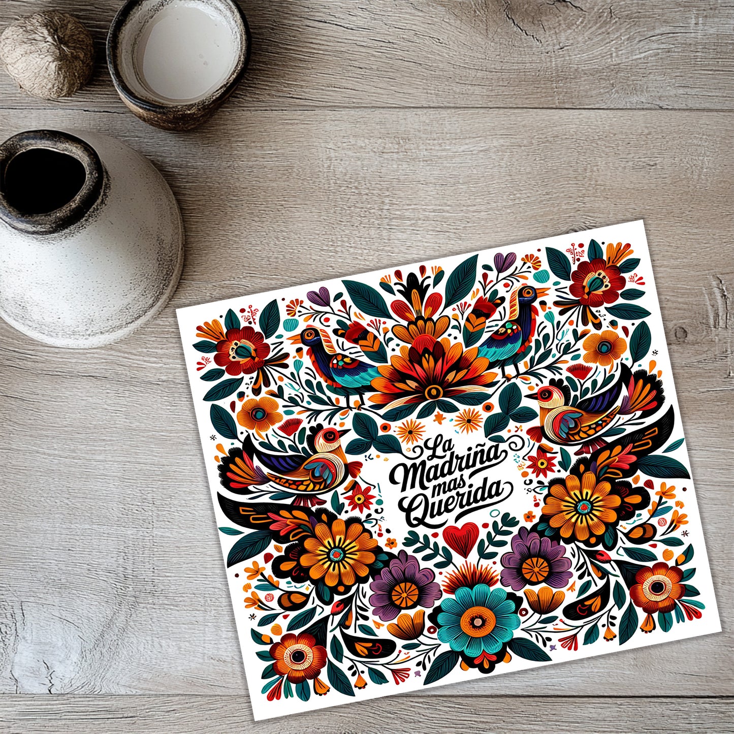 a vibrant, colorful illustration of a floral design with birds and flowers, accompanied by the text "La Mañana Queera Obras" (The Morning Birds) in a decorative font.