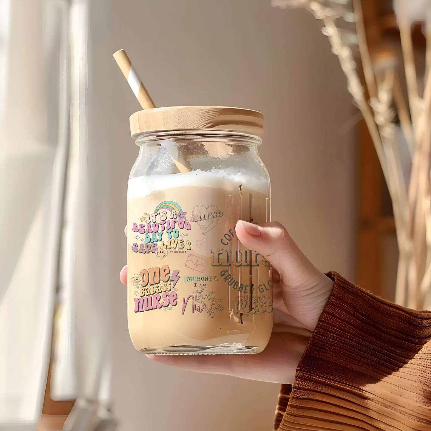 a person holding a jar with a straw in it