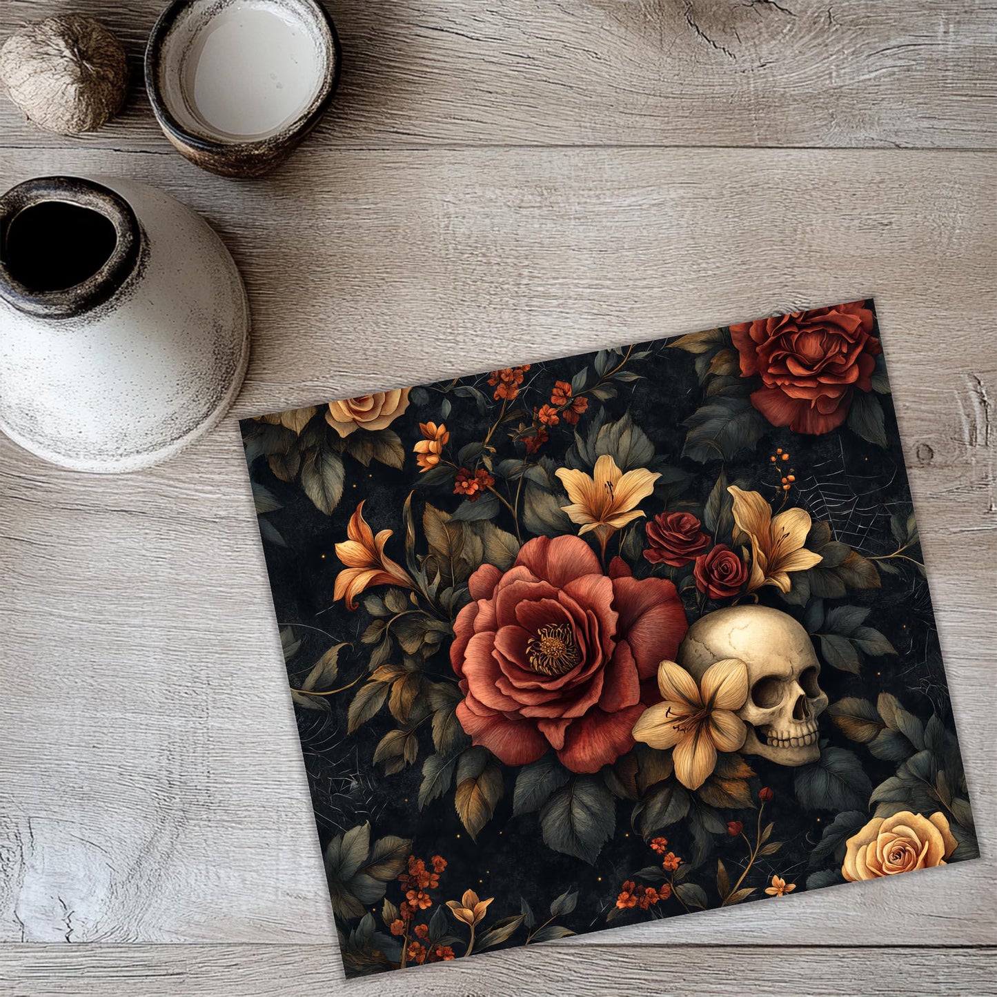 a picture of a skull and flowers on a table