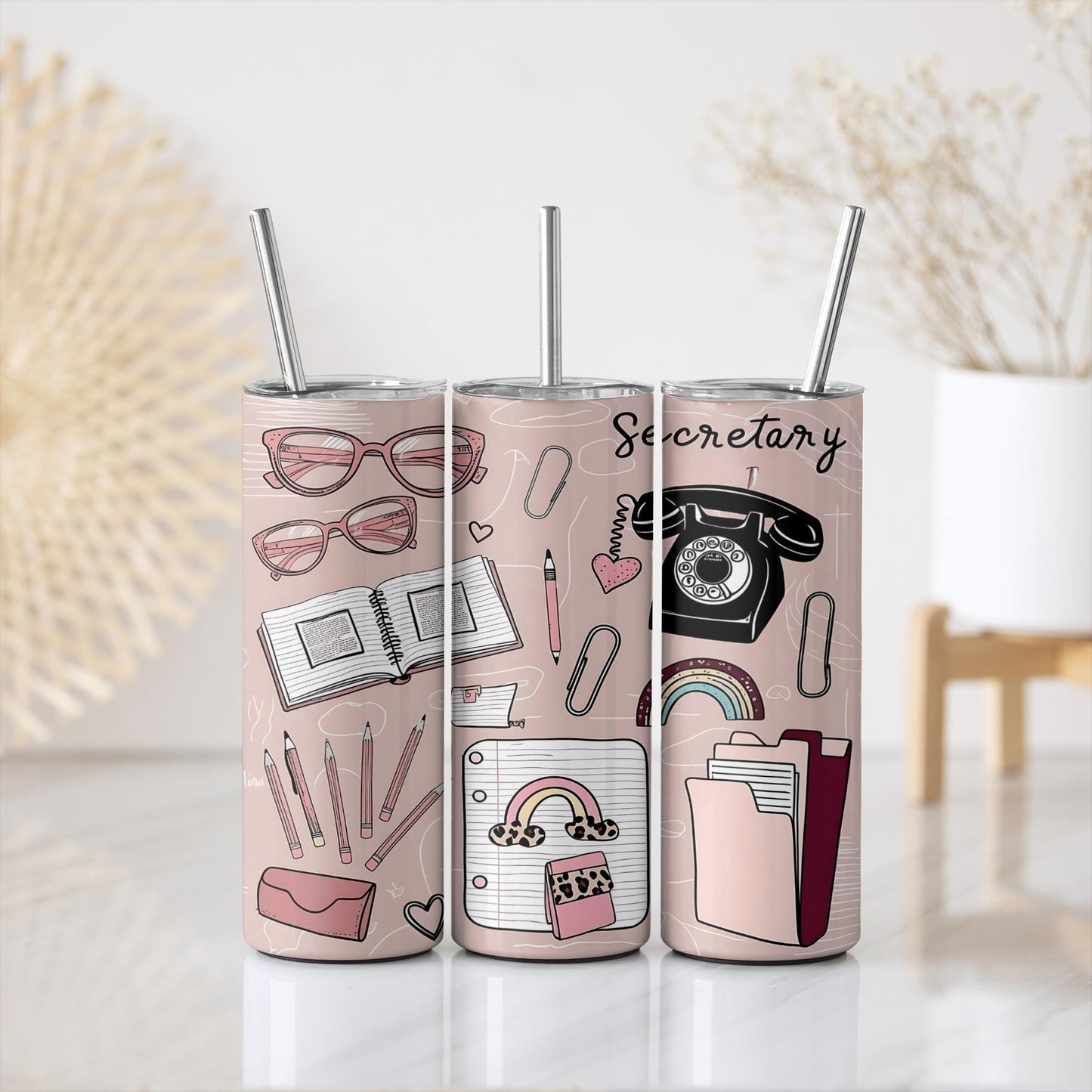 a pair of pink tumblers with a picture of different things on them