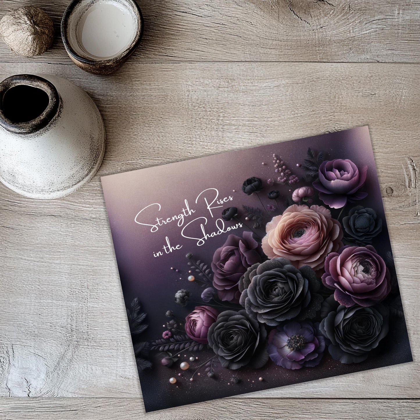 a greeting card with flowers on a table