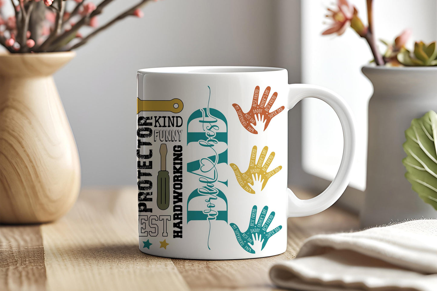 a coffee mug with hand prints on it