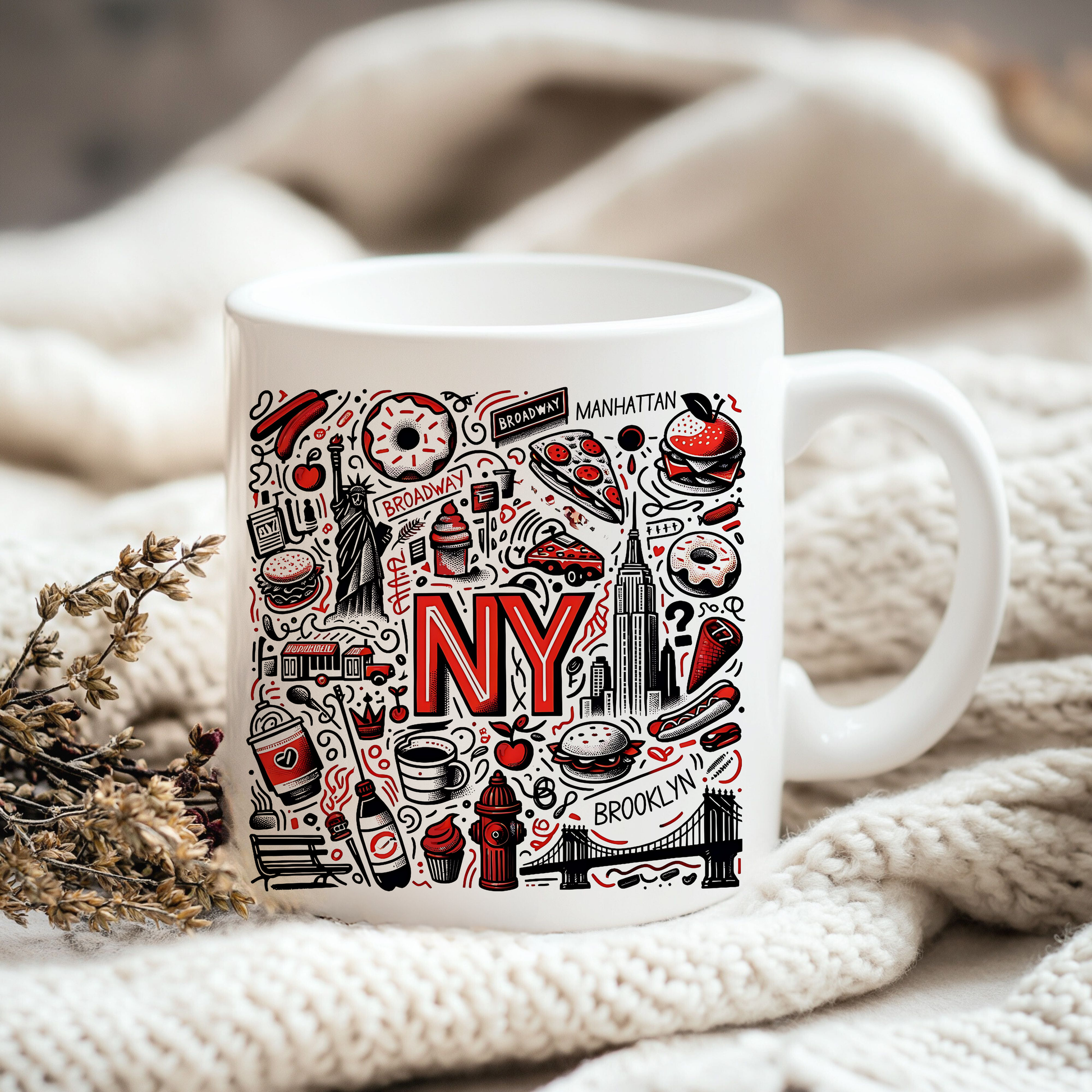 A white mug with a colorful design featuring various iconic New York City symbols and landmarks, such as the Statue of Liberty, the Empire State Building, and a hot dog.