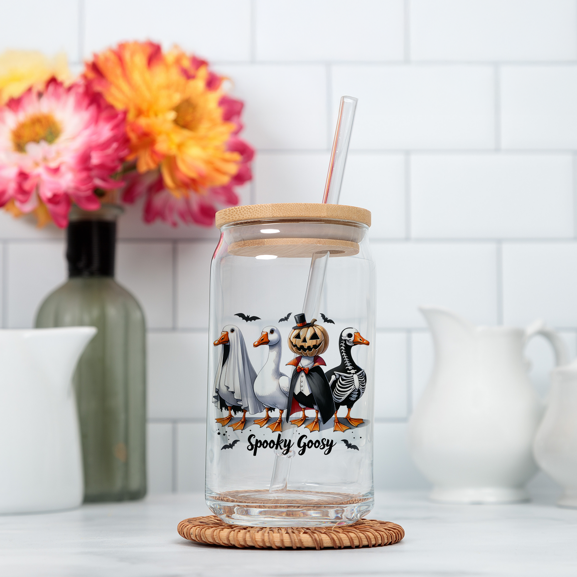 a glass jar with a straw in it sitting on a counter