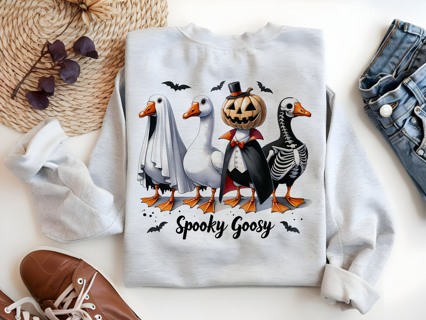 a couple of ducks wearing halloween costumes