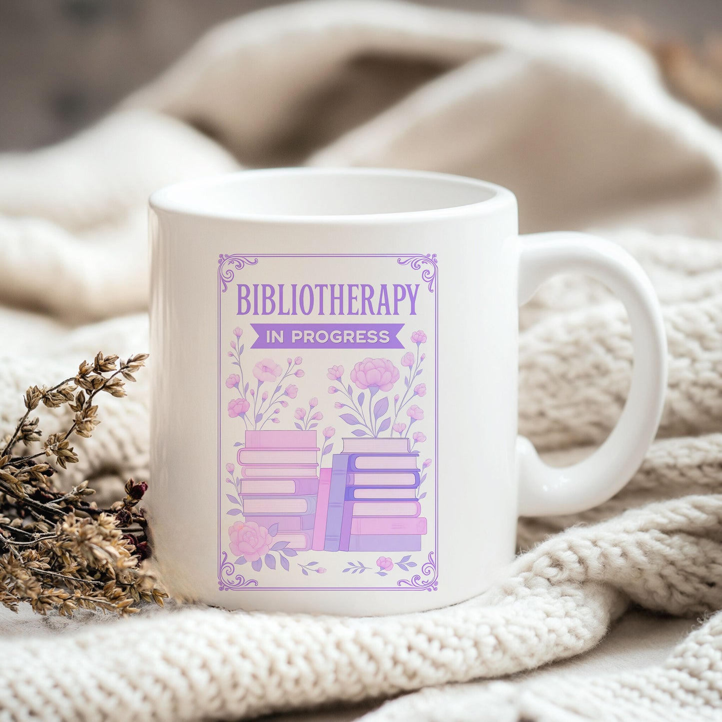 a coffee mug sitting on top of a white blanket