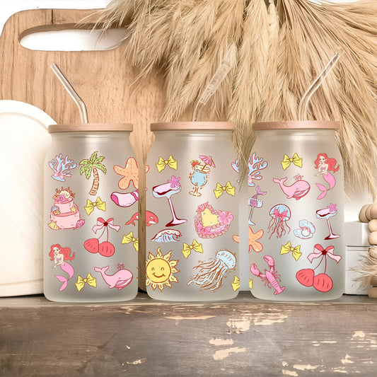 three plastic cups with stickers on them sitting on a shelf