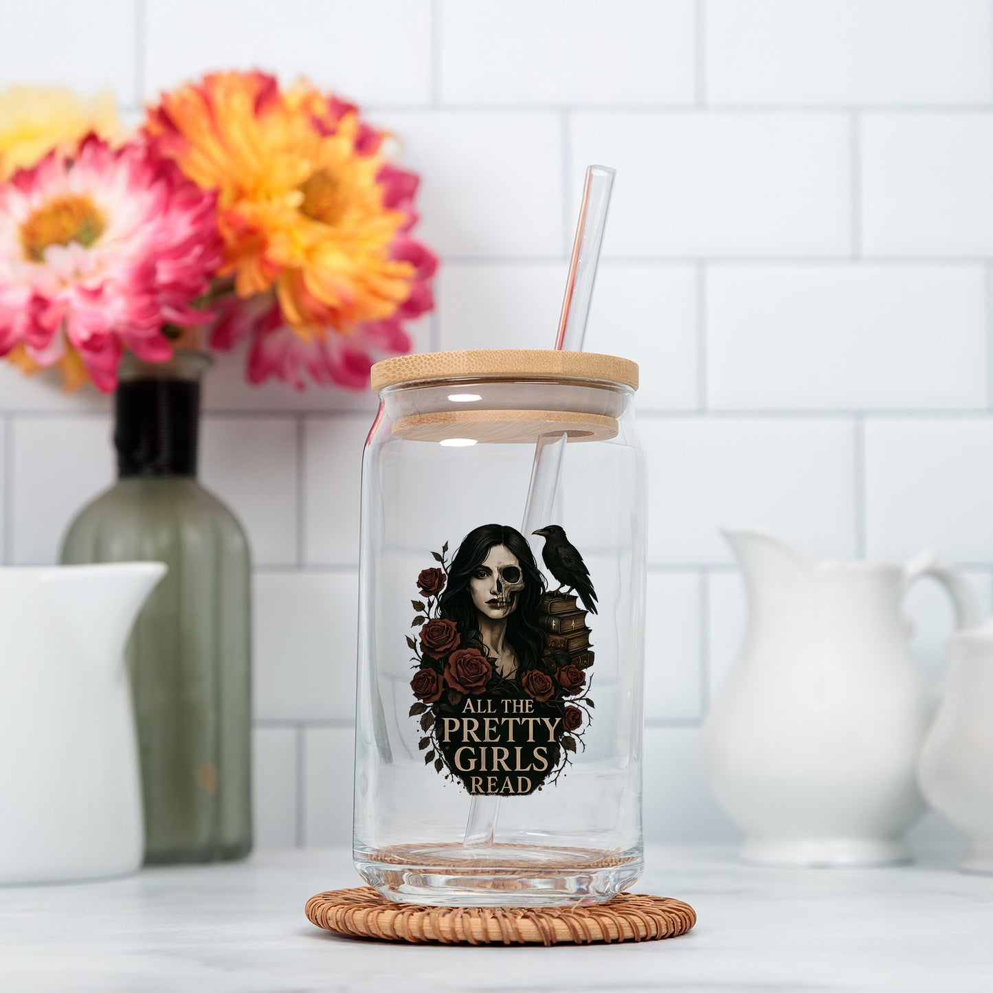 a glass jar with a straw in it on a counter