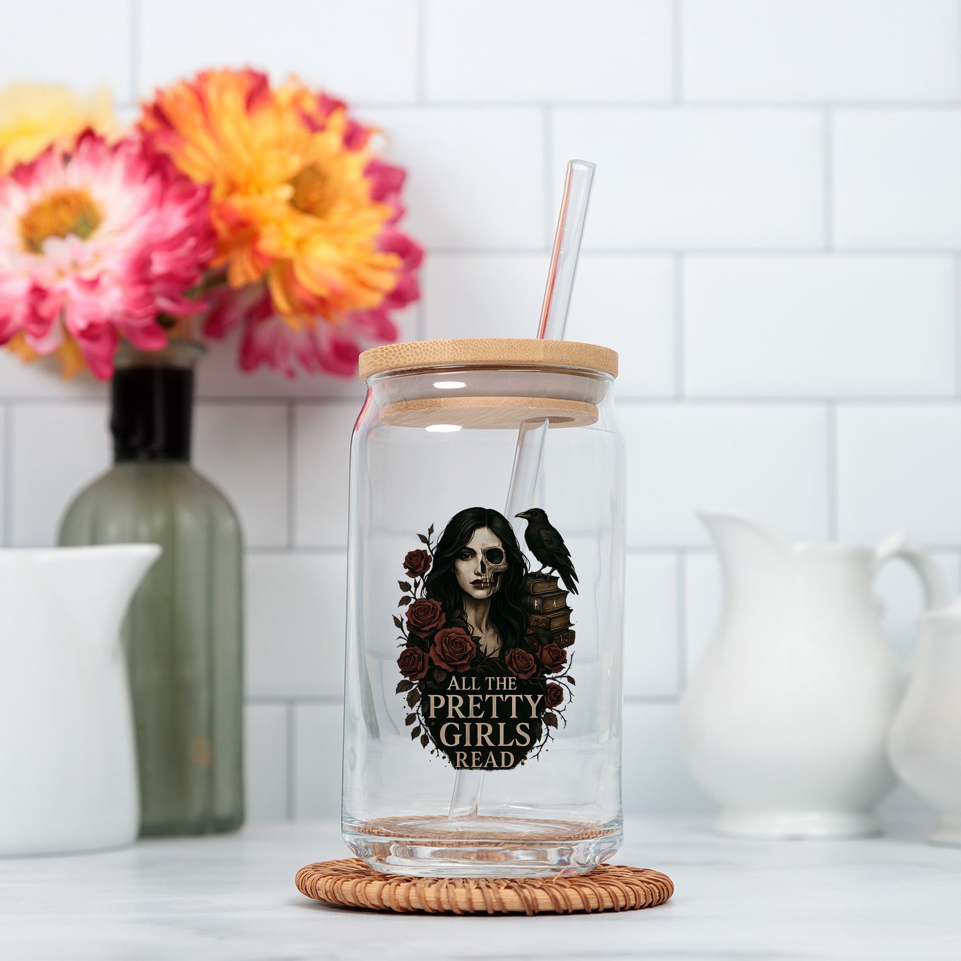a glass jar with a straw in it on a counter