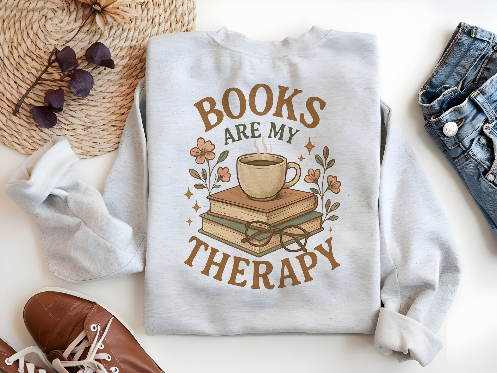 a white sweatshirt with books are my therapy on it