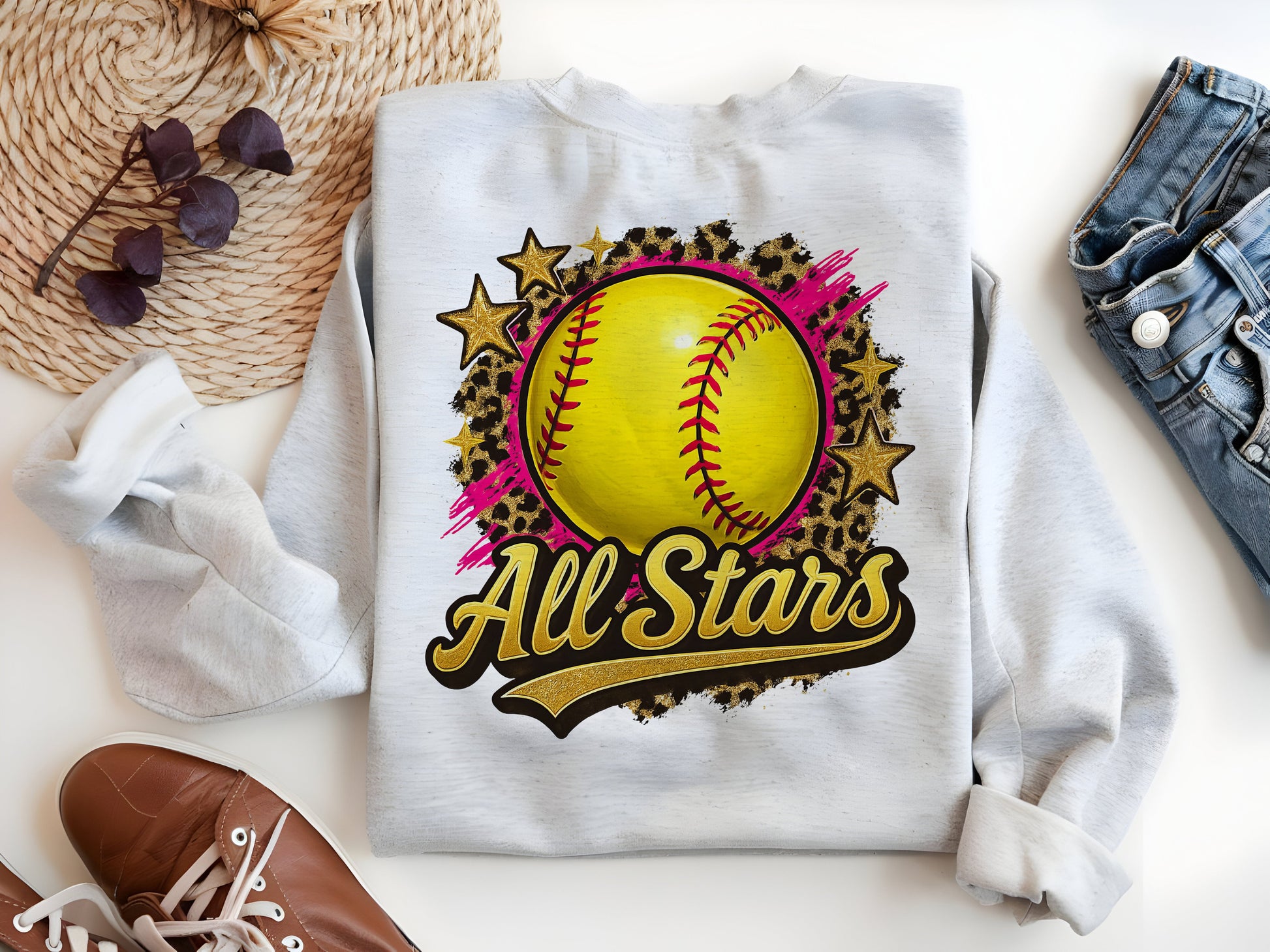 a white sweatshirt with a yellow softball on it