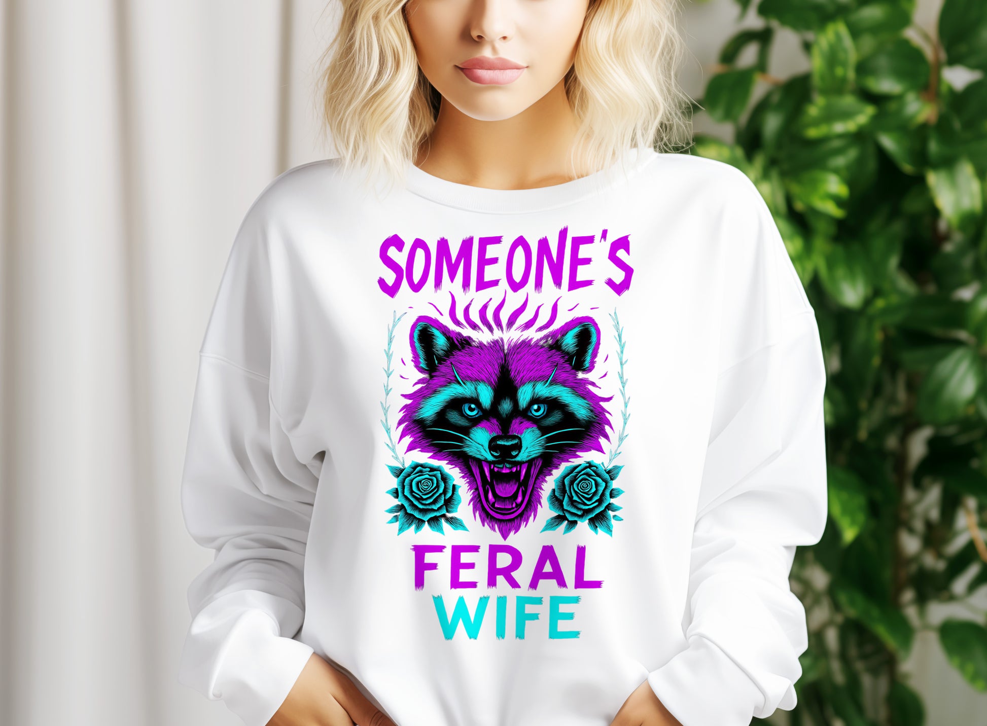 a woman wearing a sweatshirt that says someone's feral wife