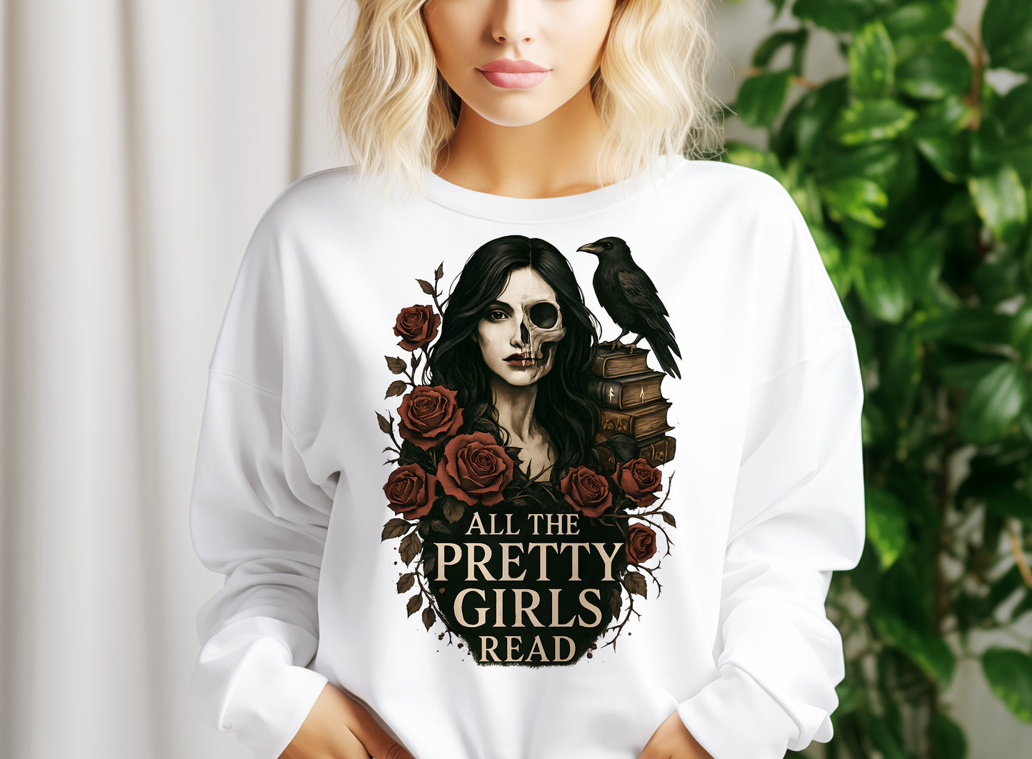 a woman wearing a white sweatshirt with a skull and roses on it