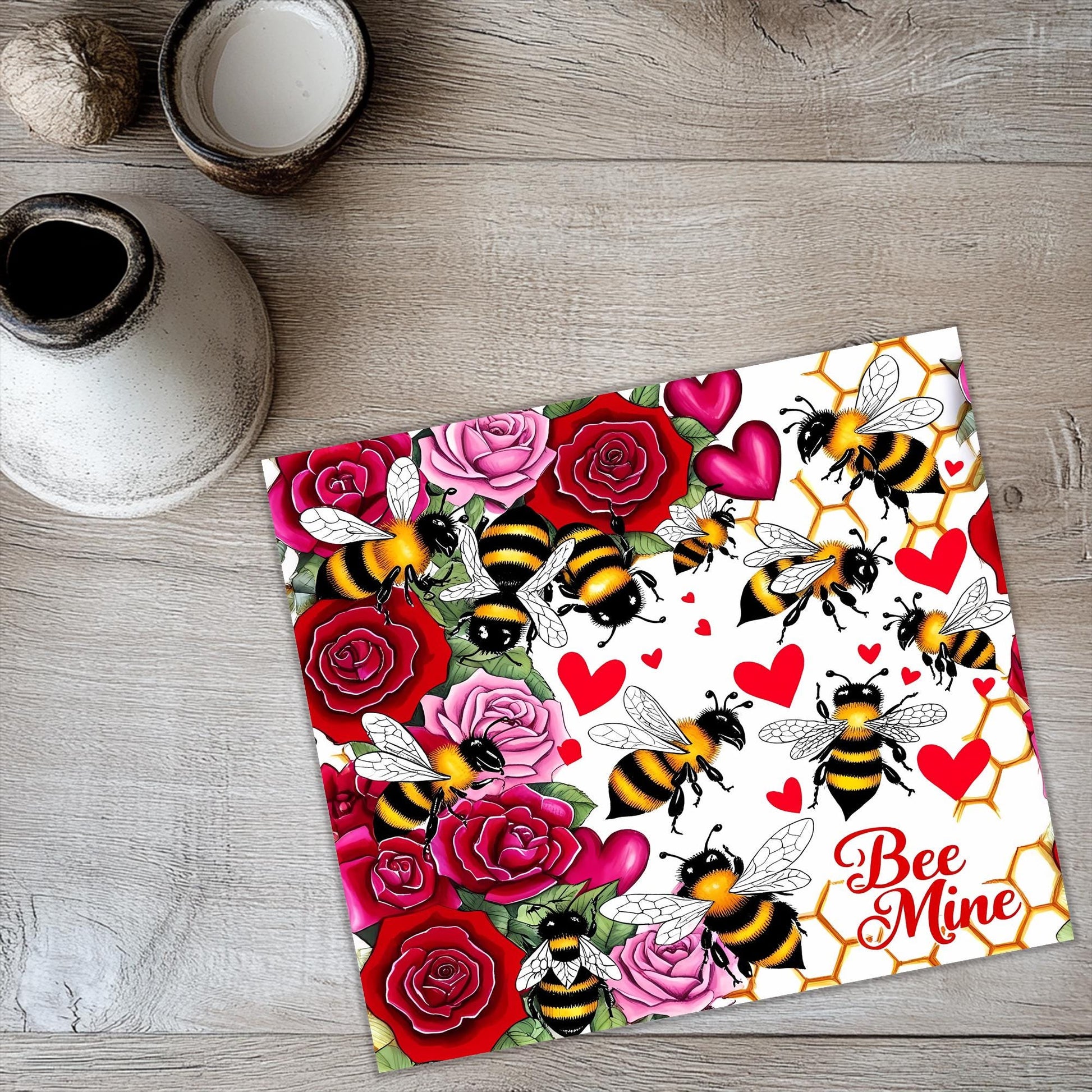a card with a bee and roses pattern on it