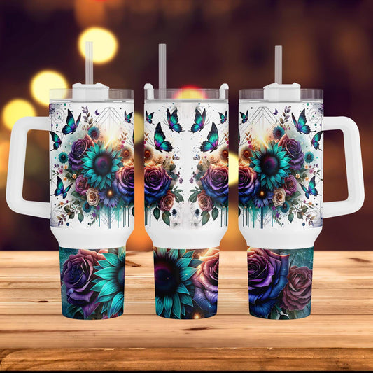 three travel mugs with floral designs on them
