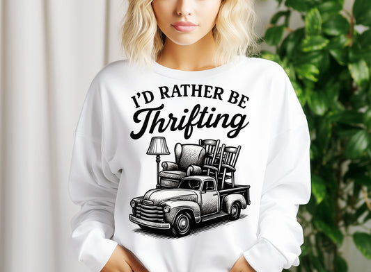 a woman wearing a white sweatshirt with a black graphic of a truck