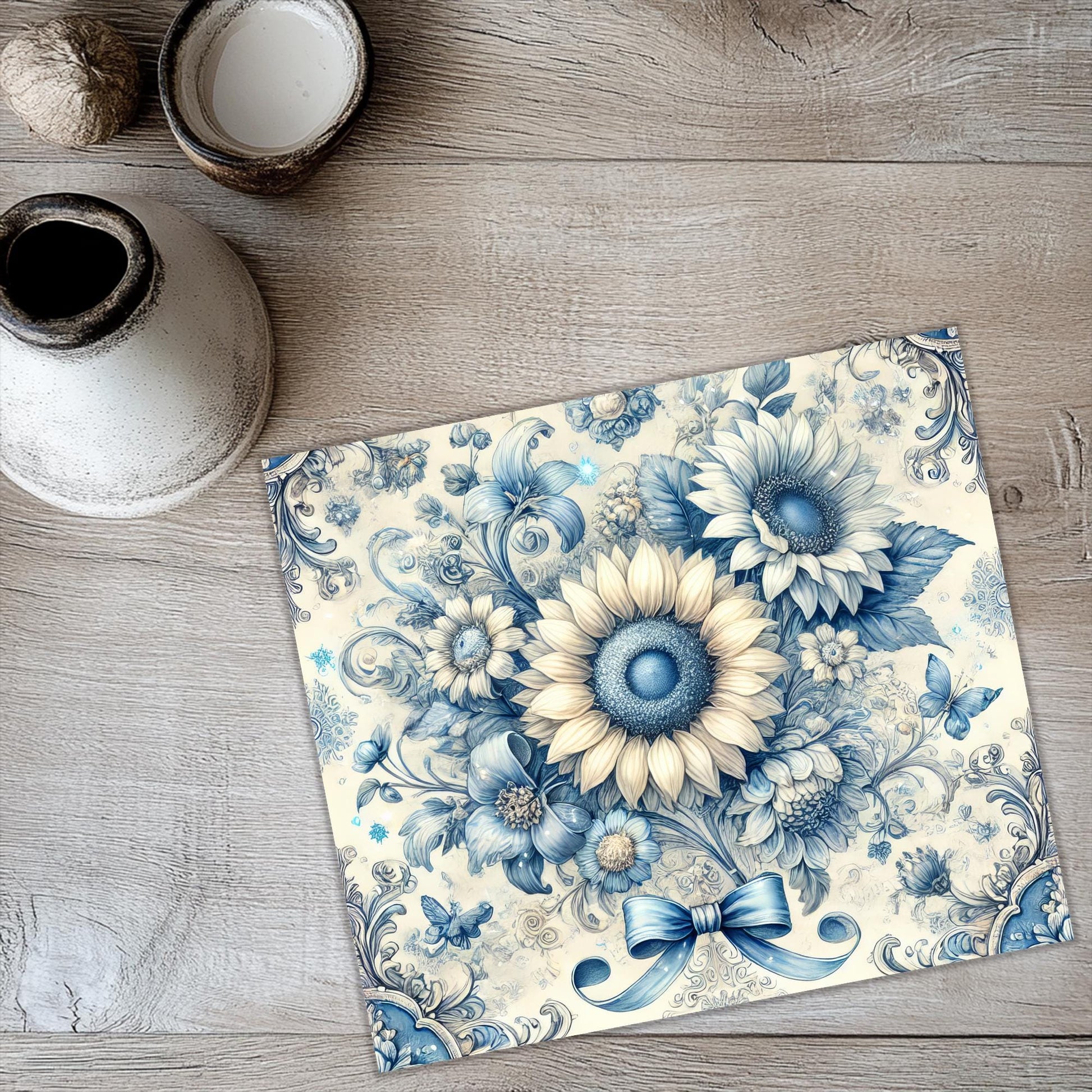 a blue and white tile with flowers on it