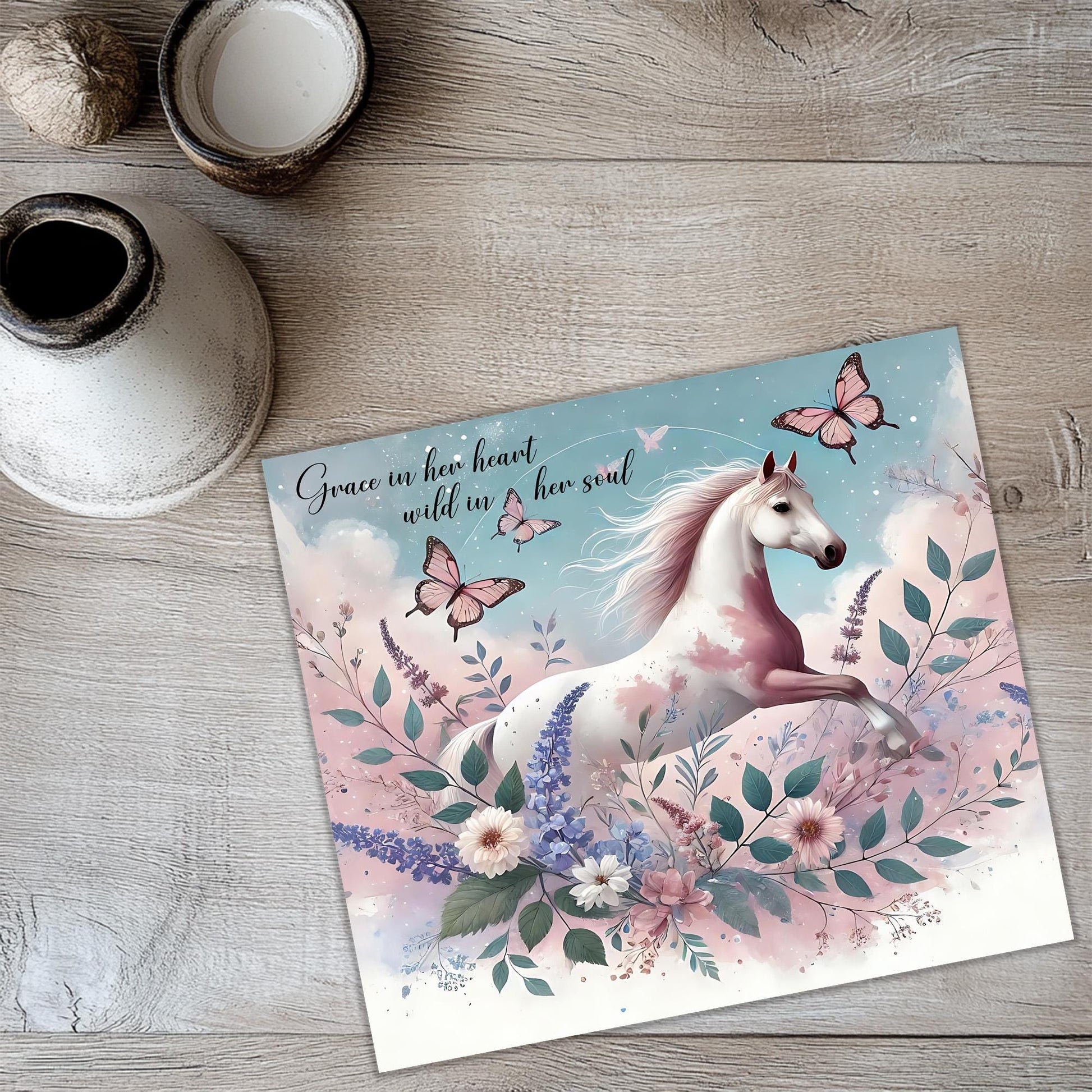a card with a picture of a white horse