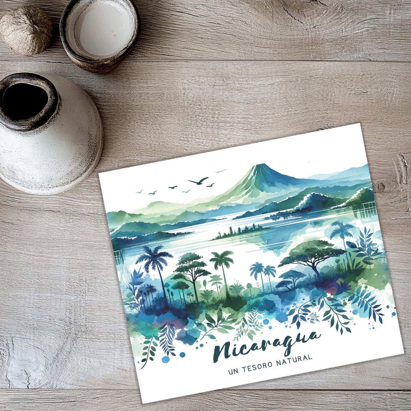 a card with a watercolor painting of a tropical landscape