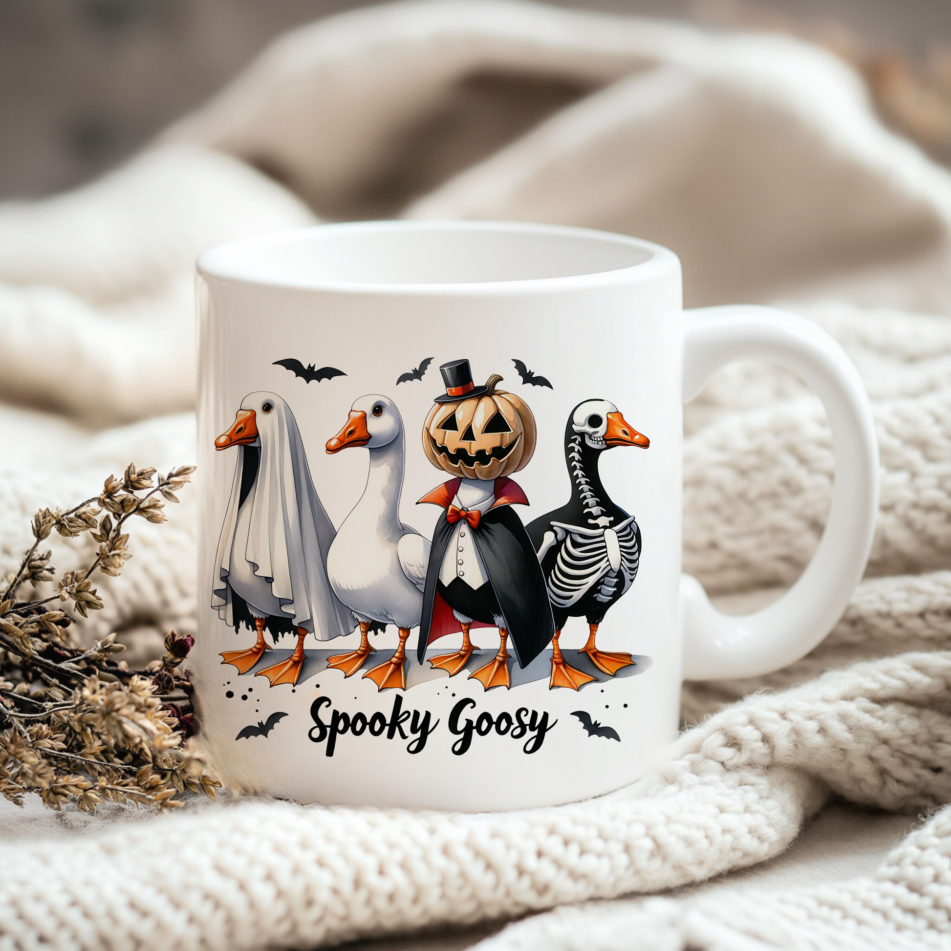 a white coffee mug with a halloween scene on it