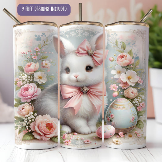 a white cat with a pink bow sitting next to an egg