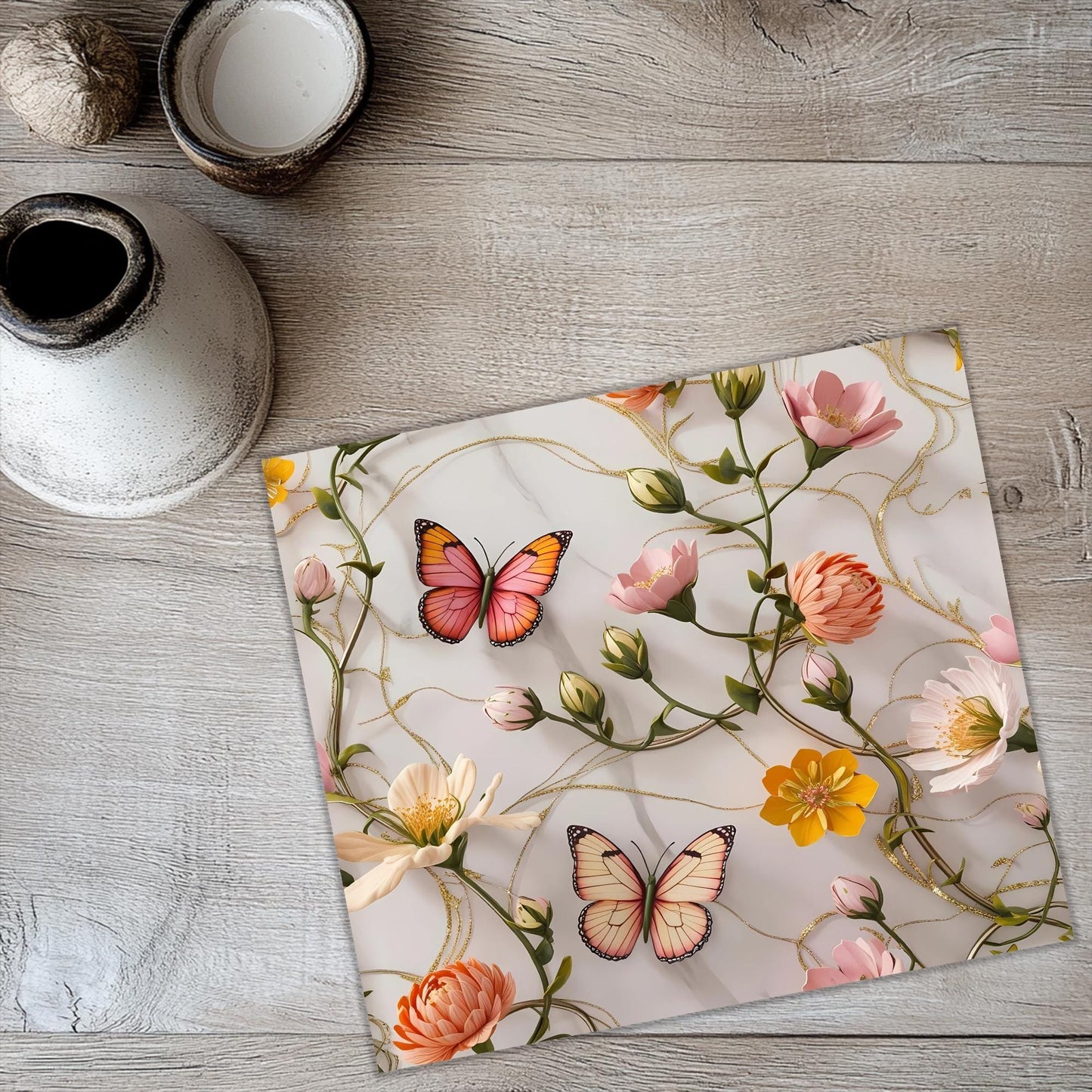 a picture of a butterfly and flowers on a table