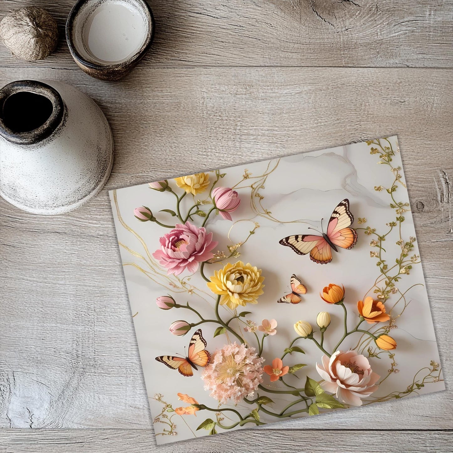a glass plate with flowers and butterflies on it