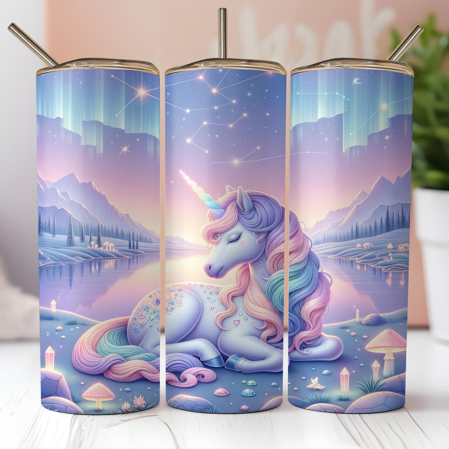 a set of three travel mugs with a picture of a unicorn