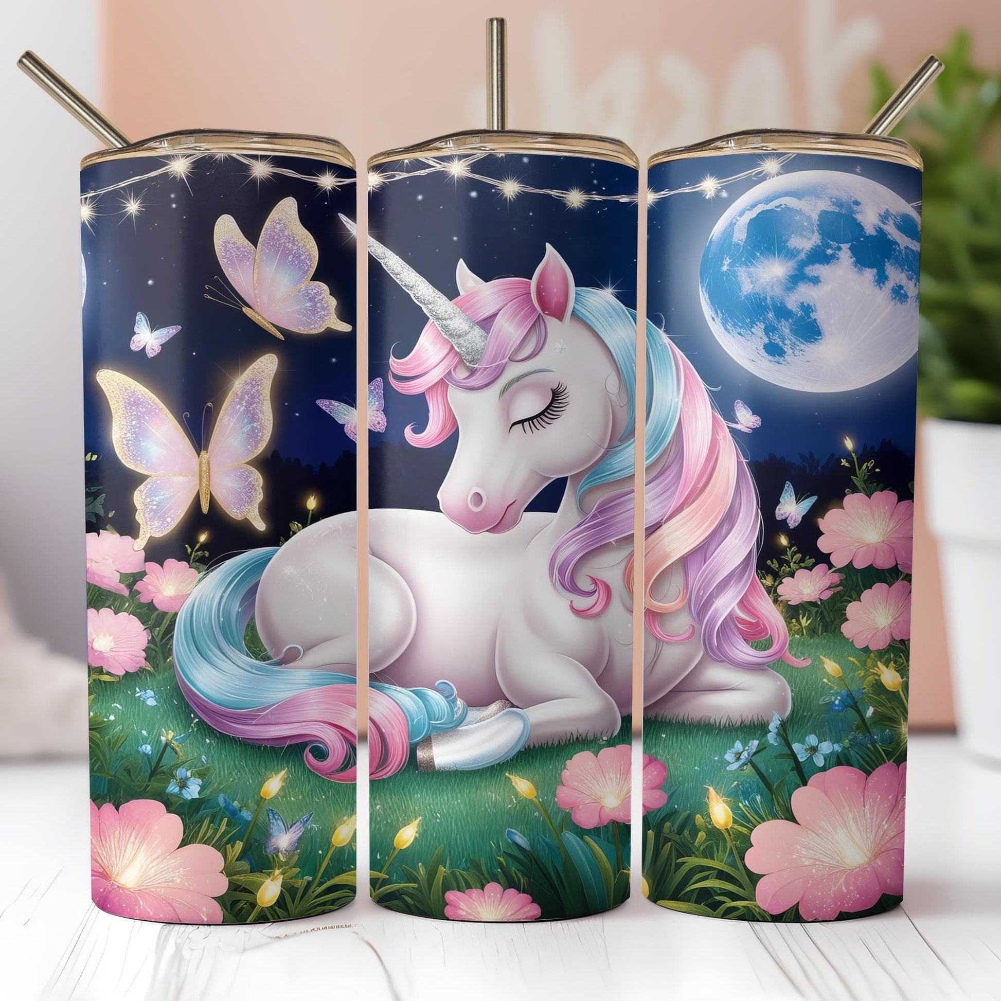 a group of three cups with unicorns on them