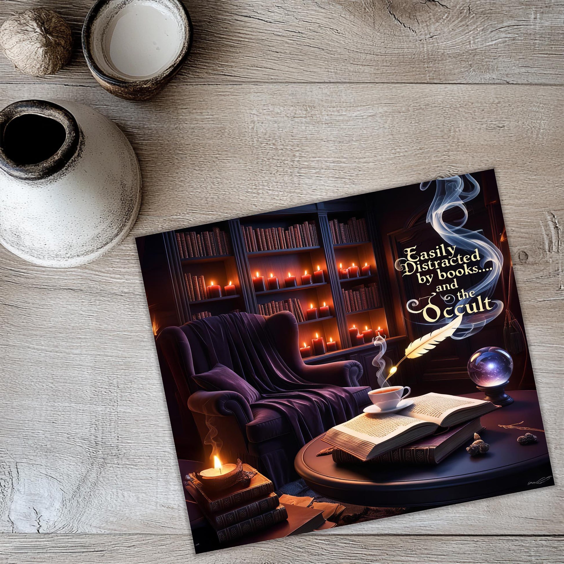 a picture of a book and a candle on a table