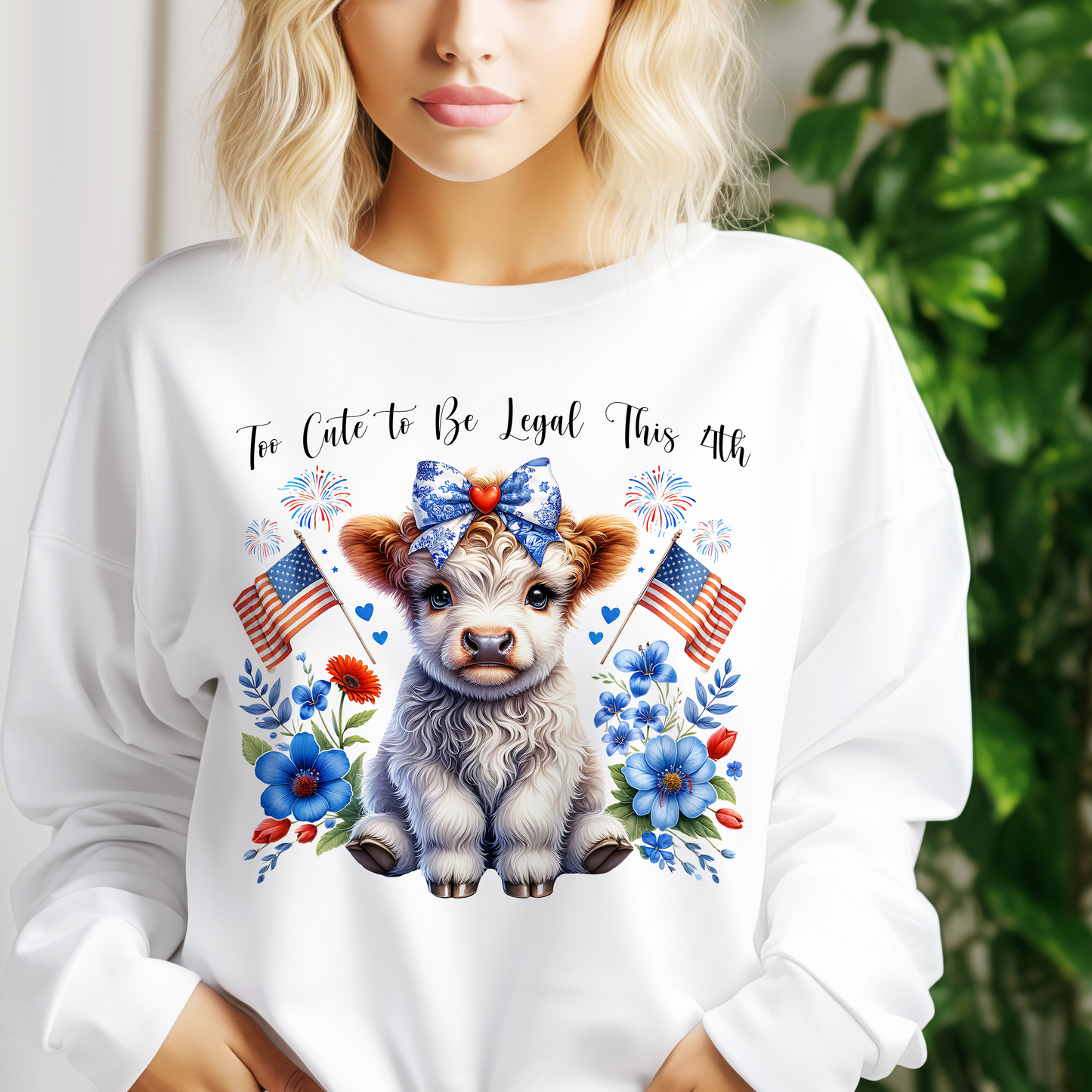 a woman wearing a white shirt with a cow on it