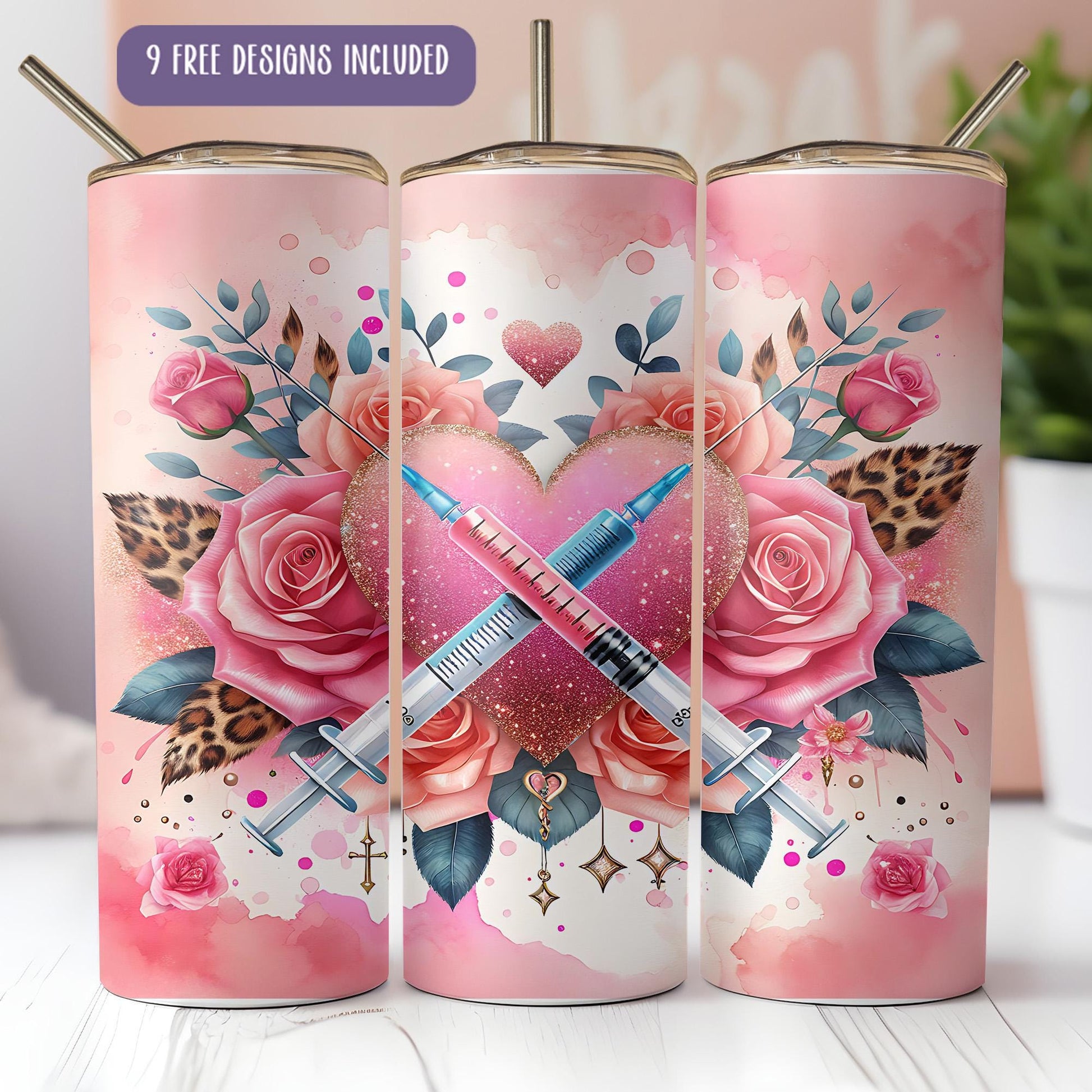 a set of three pink tumbles with roses and a pen