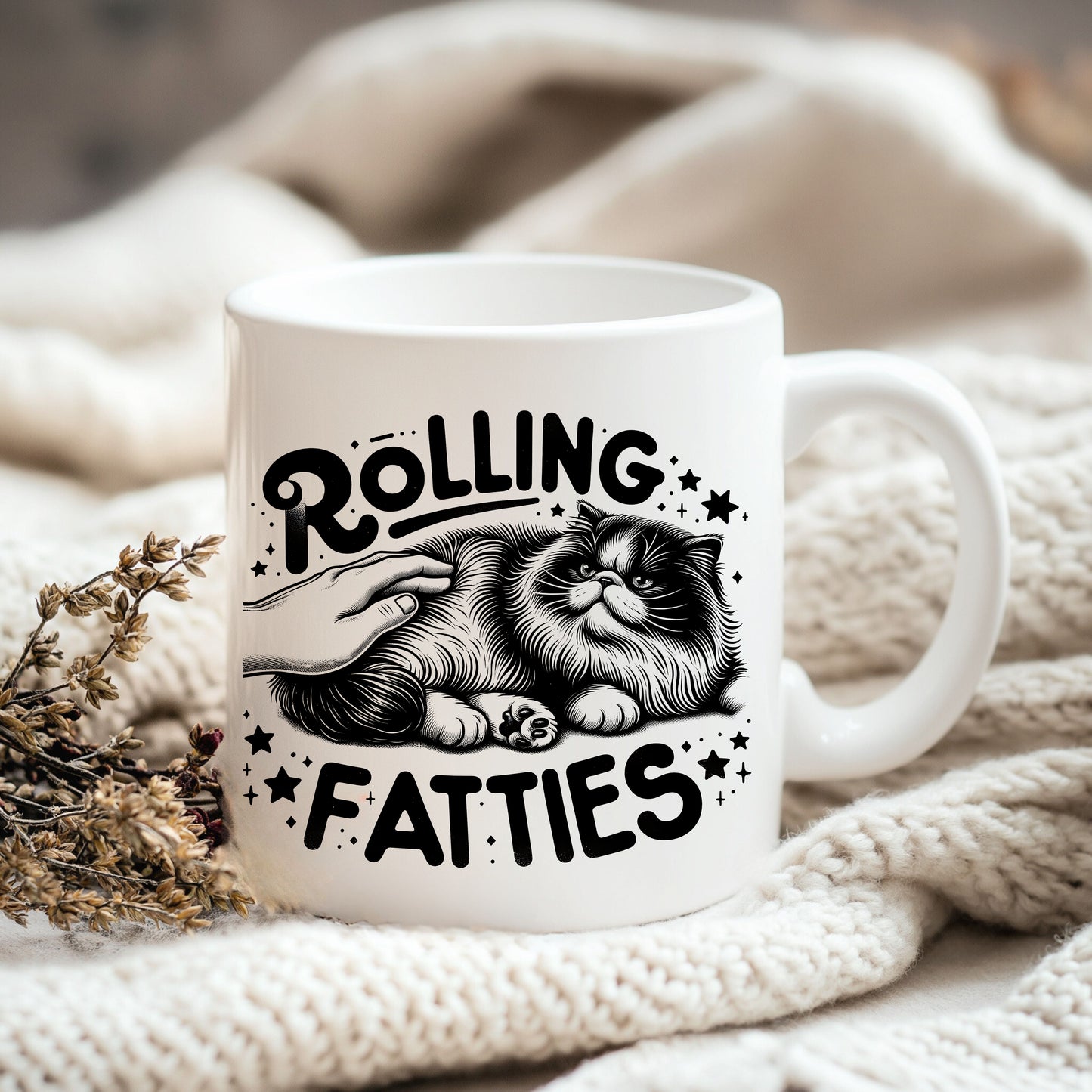 a white coffee mug with a cat on it