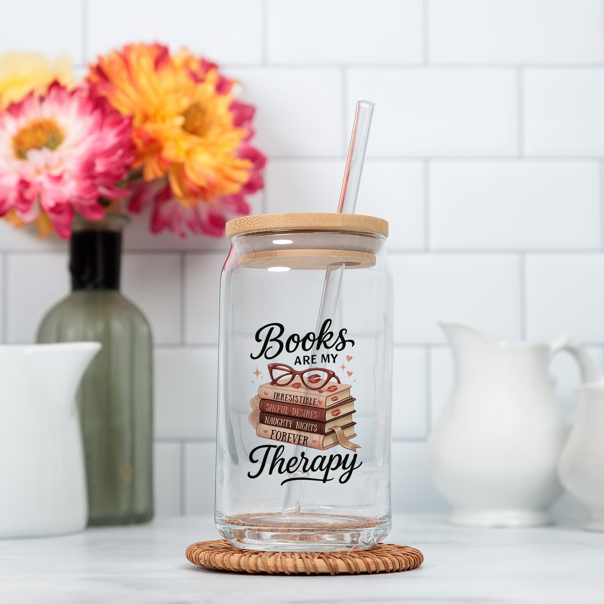 a glass jar filled with books and a straw
