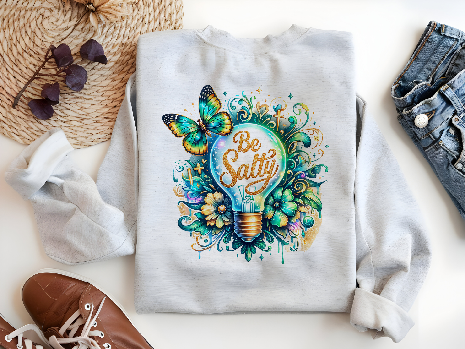 a sweatshirt with a light bulb and butterflies on it