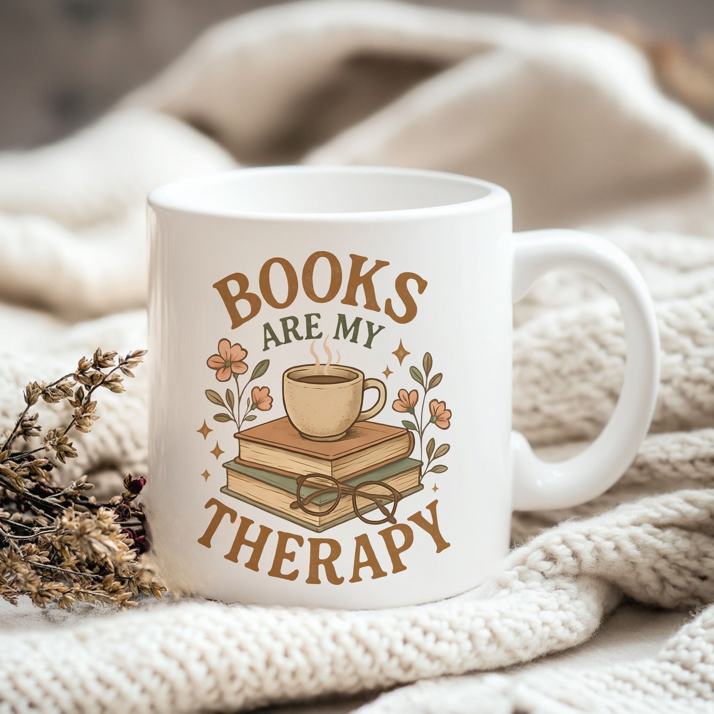 a coffee mug with books are my therapy on it