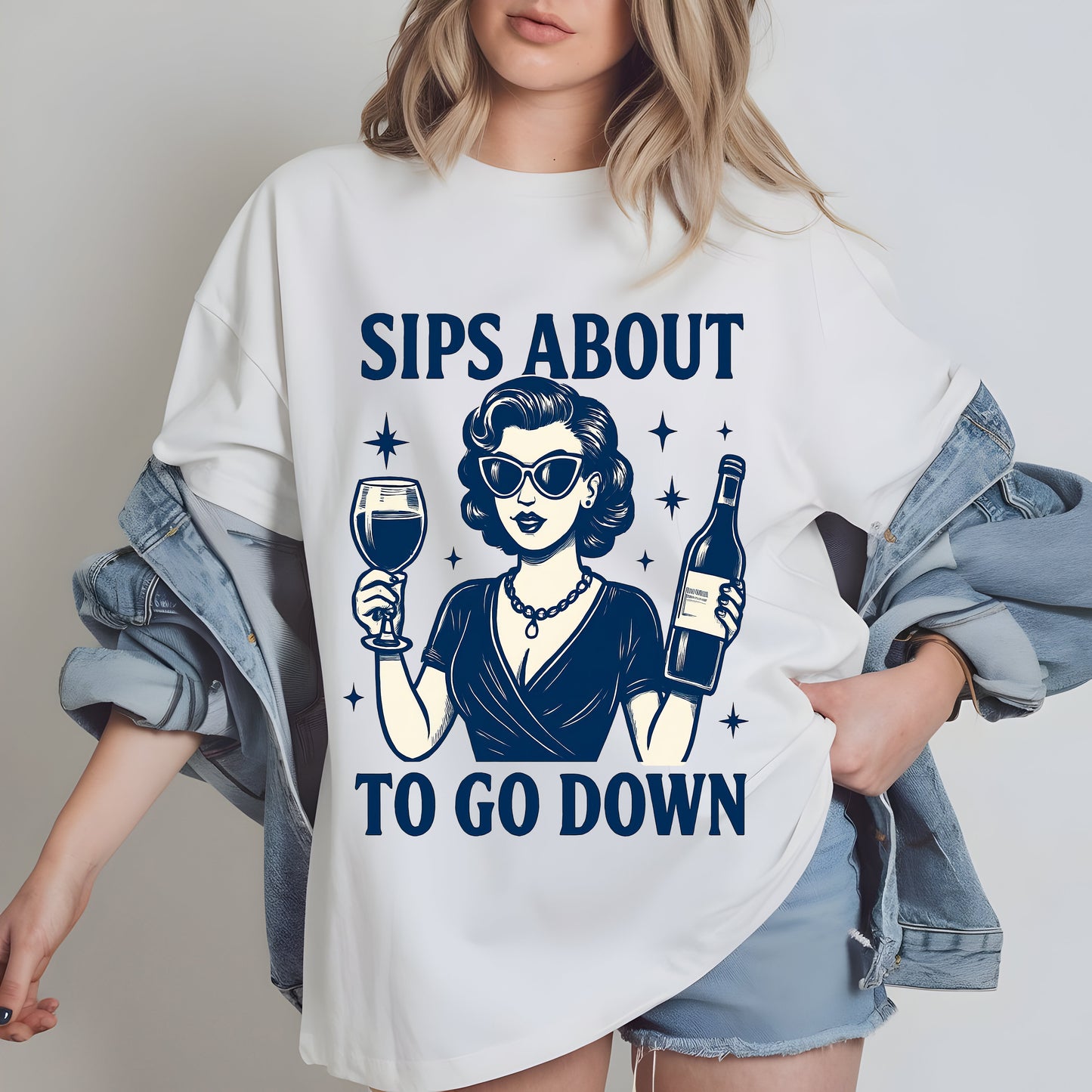 a woman wearing a t - shirt that says sips about to go down