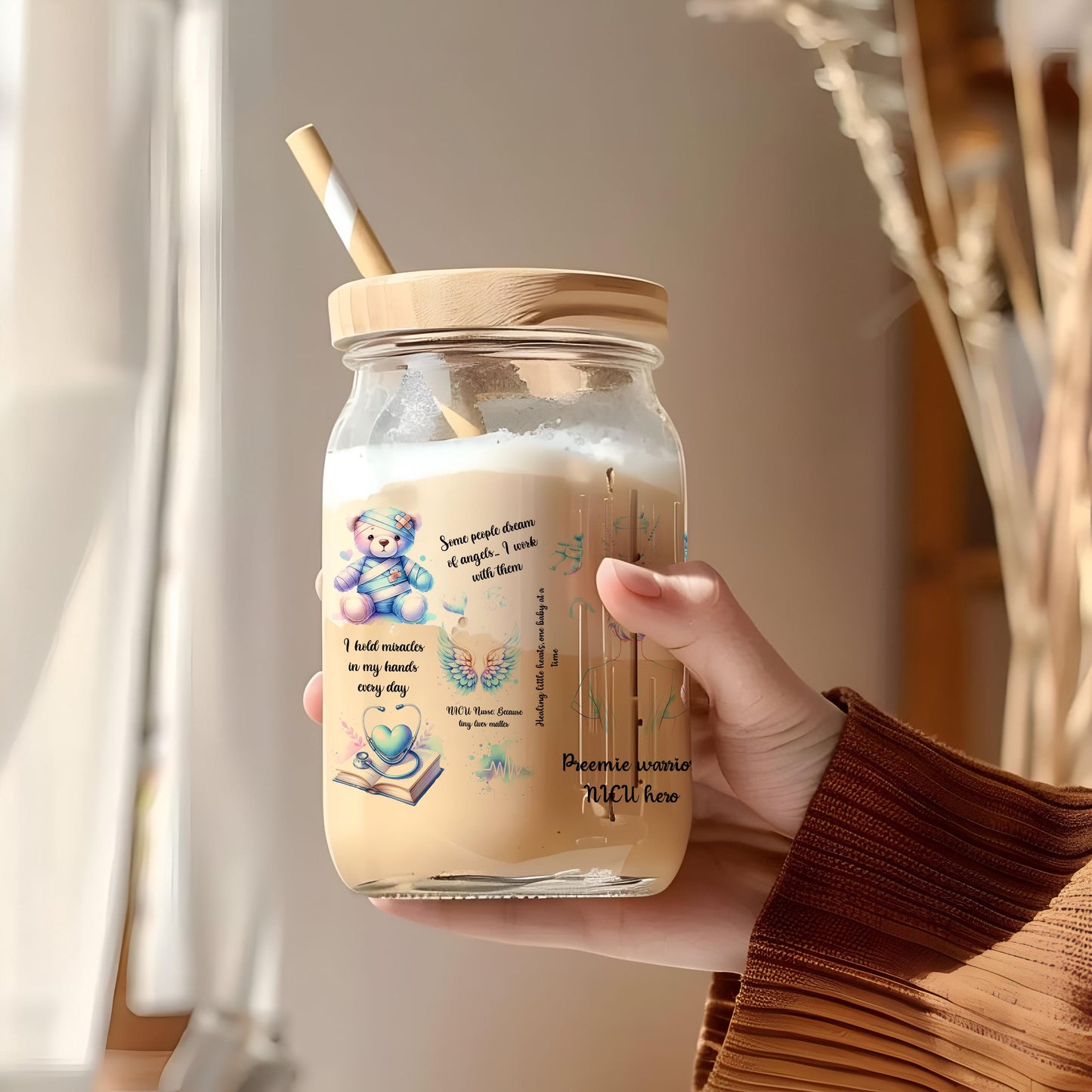 a person holding a jar with a straw in it